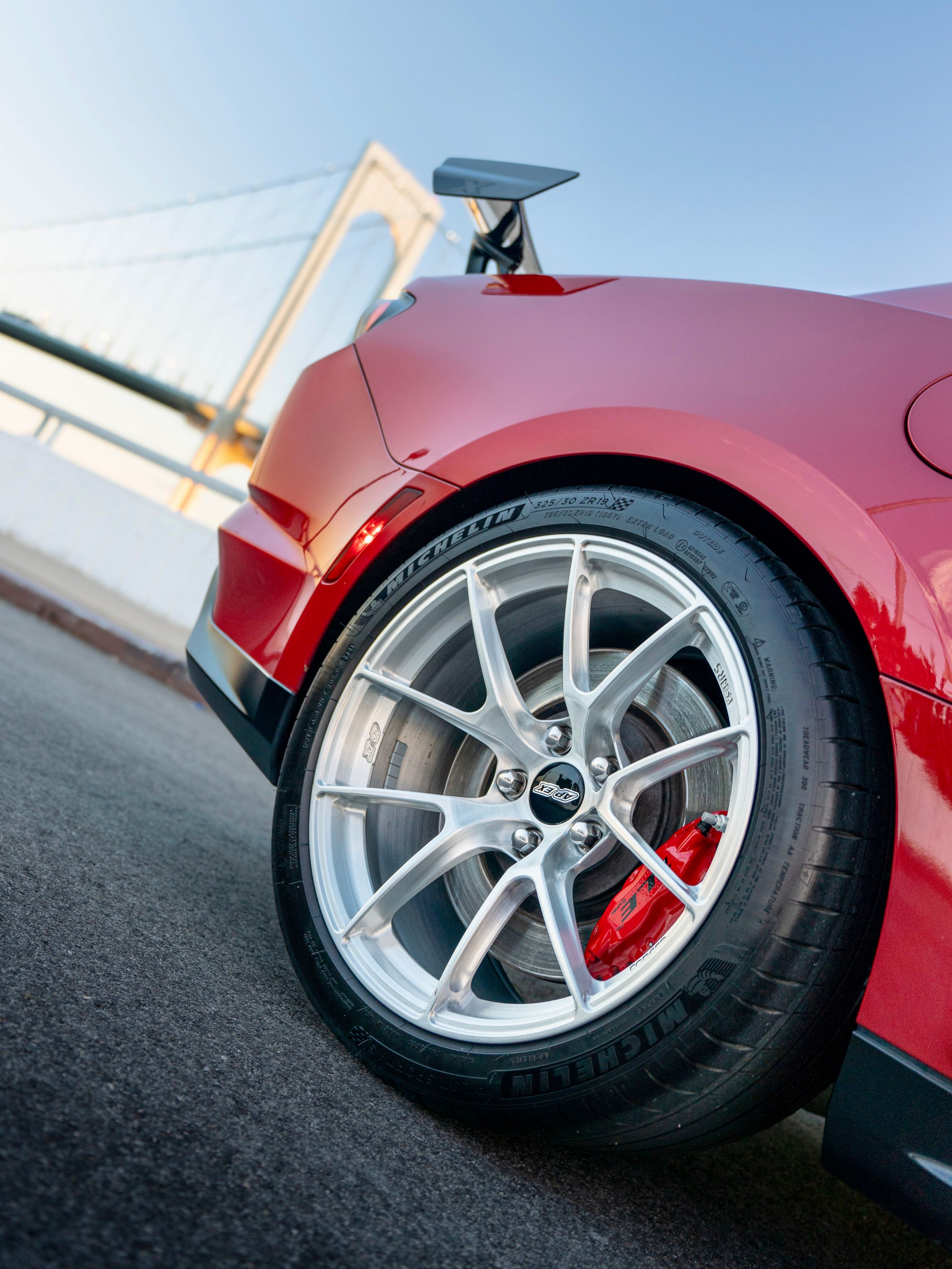 Red Chevrolet 6th Gen Camaro ZL1 1LE with 19" VS-5RS Apex wheels in Brushed Clear