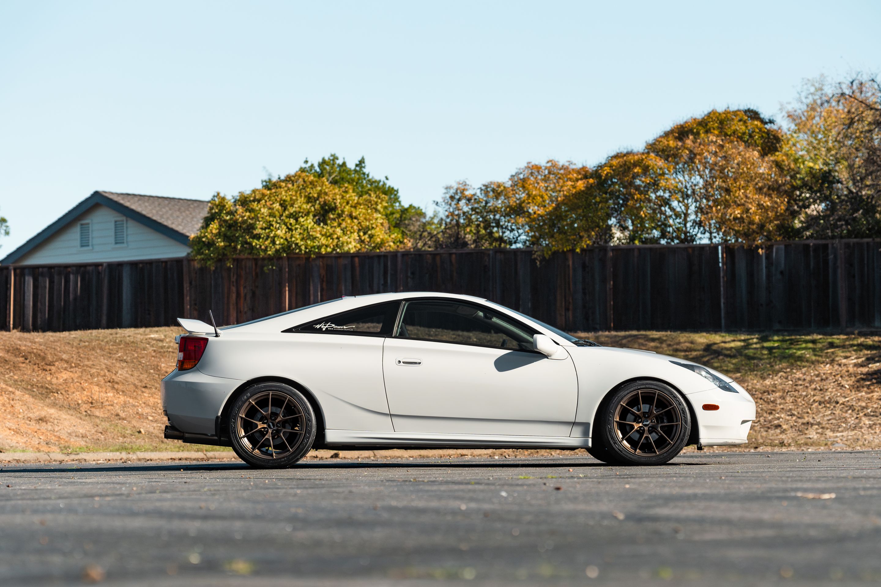 White Toyota 7th Gen Celica with 17" VS-5RS Apex wheels in Satin Bronze