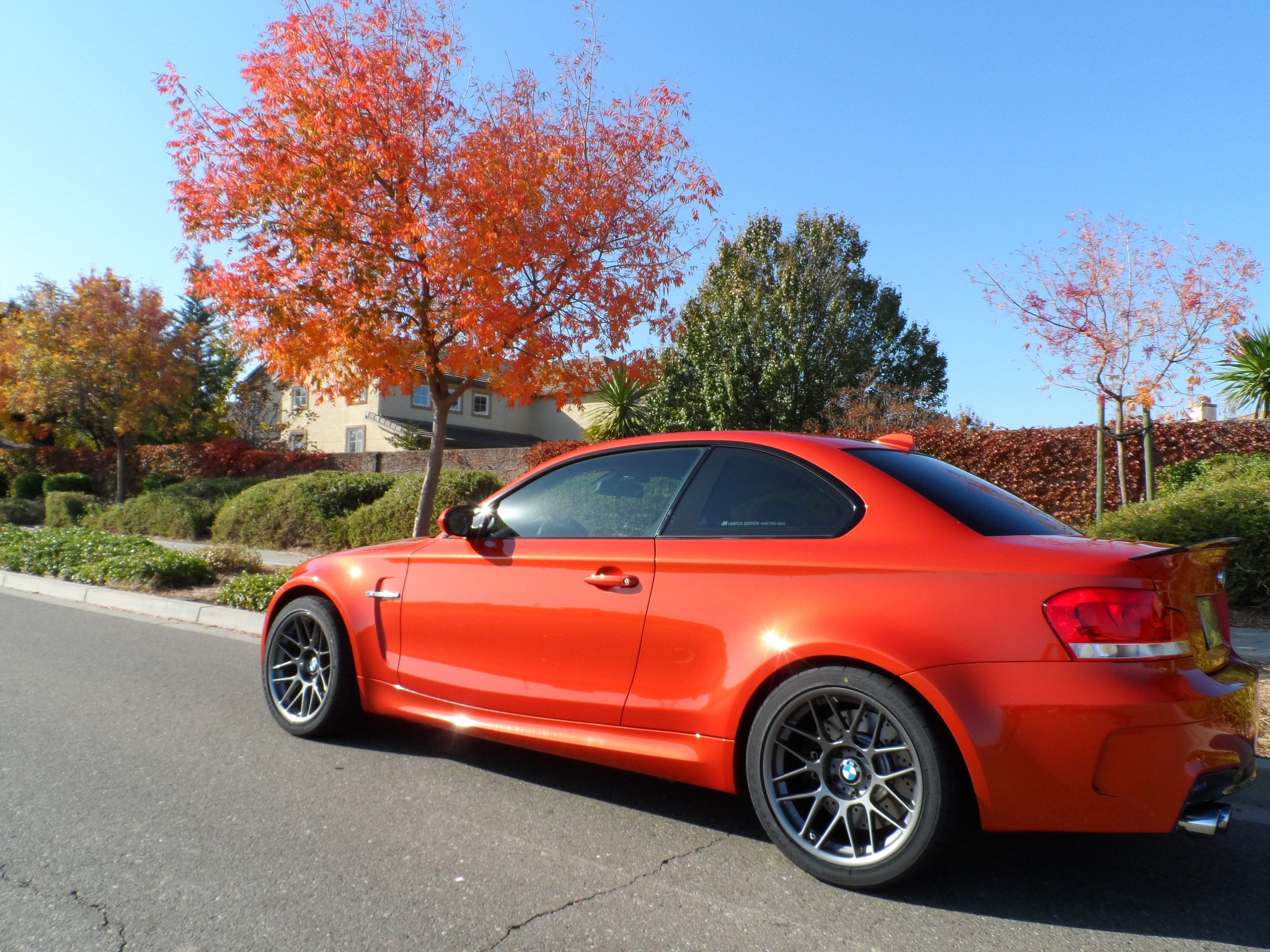 Orange BMW E82 1M with 18" ARC-8 Apex wheels in Satin Black