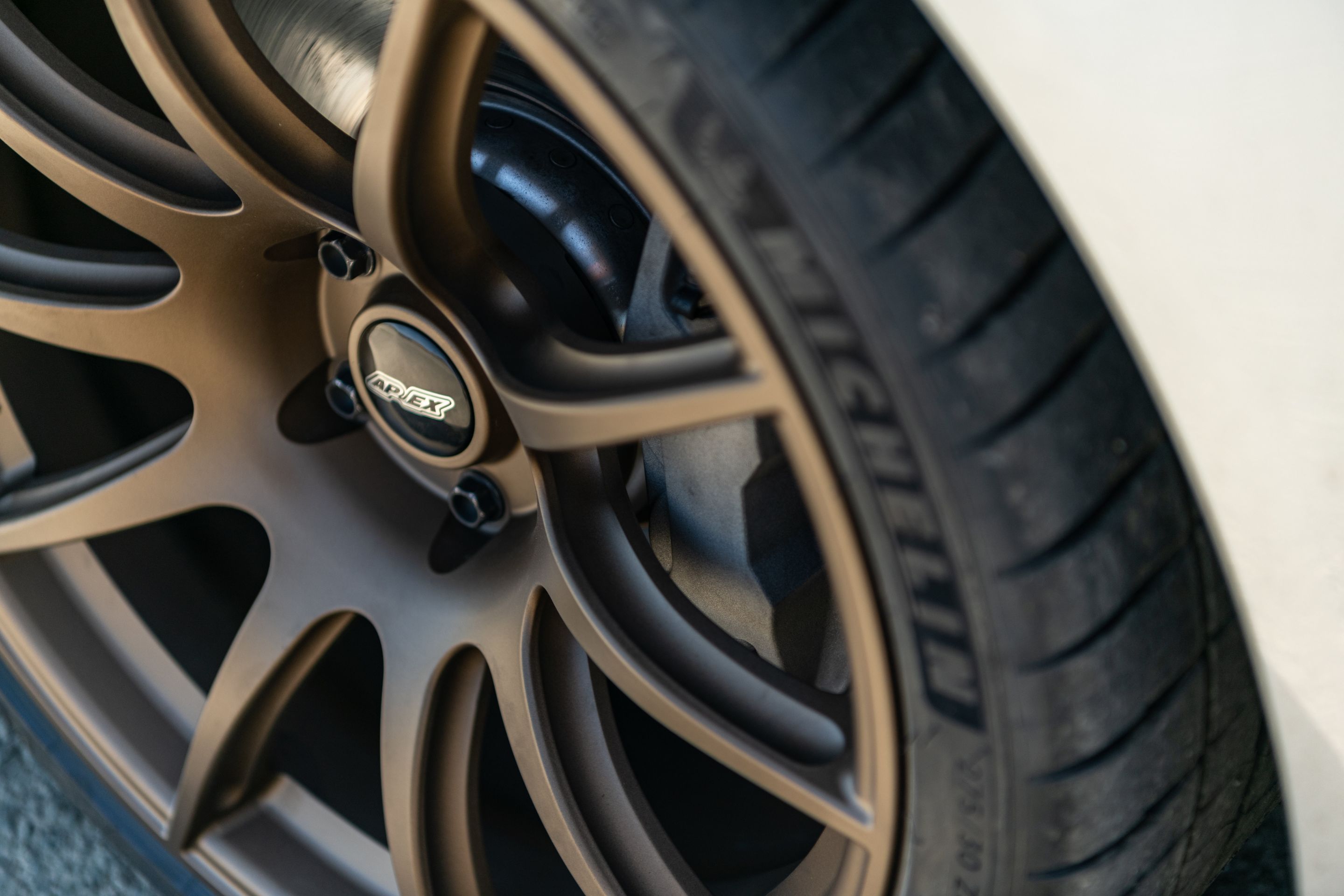 Silver Toyota GR Supra with 19" SM-10 Apex wheels in Satin Bronze