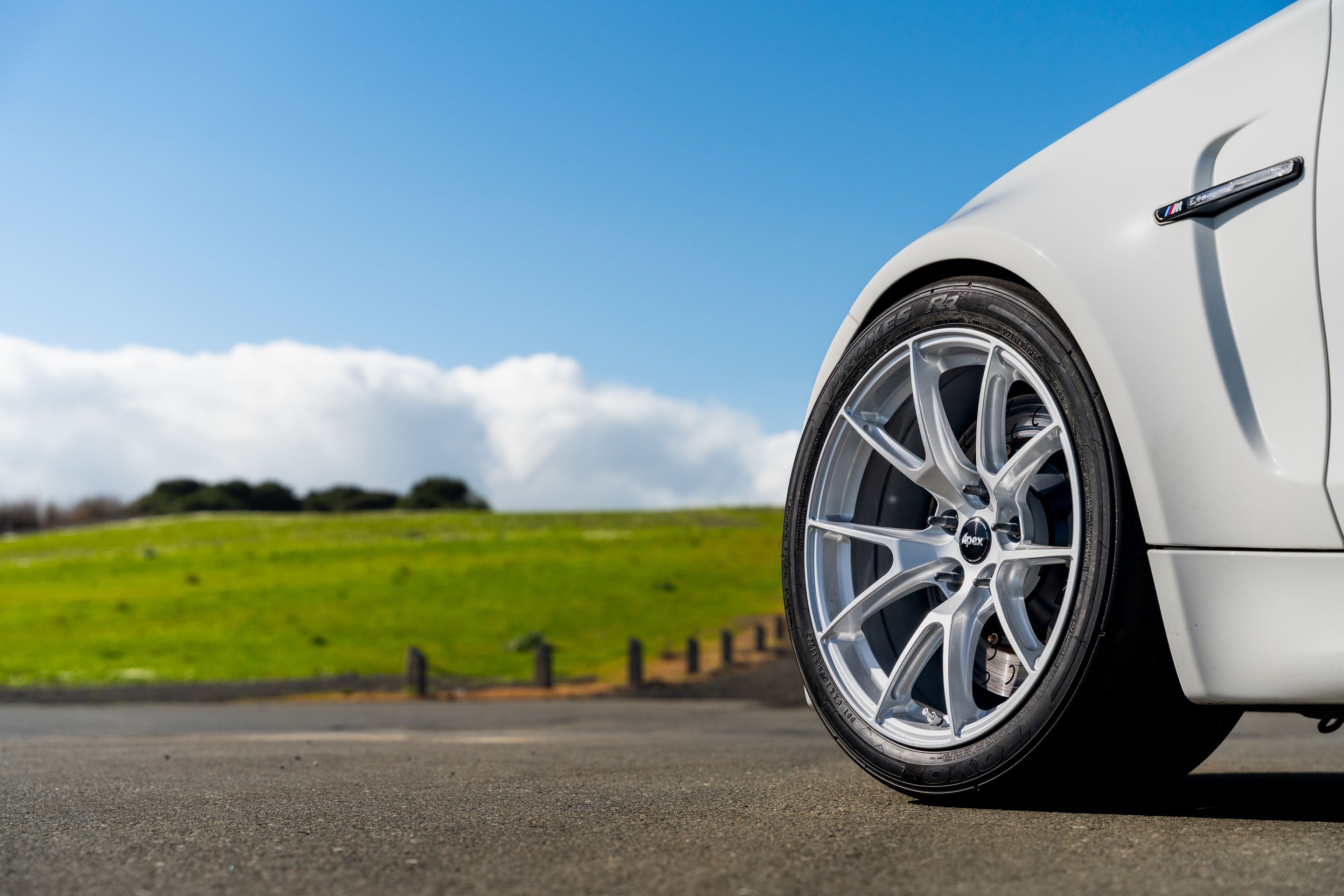 White BMW E82 1M with 18" VS-5 Apex wheels in Race Silver