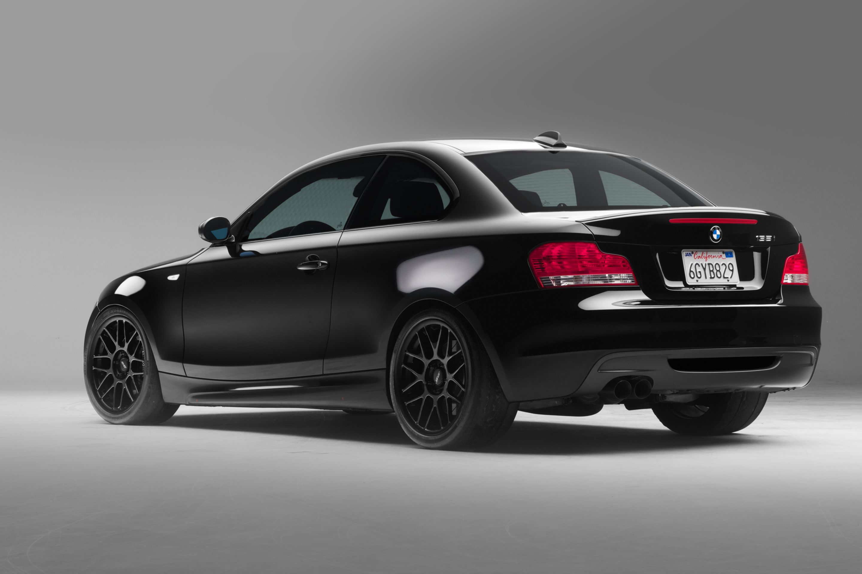 Black BMW E82 Coupe 1 Series with 18" ARC-8 Apex wheels in Satin Black
