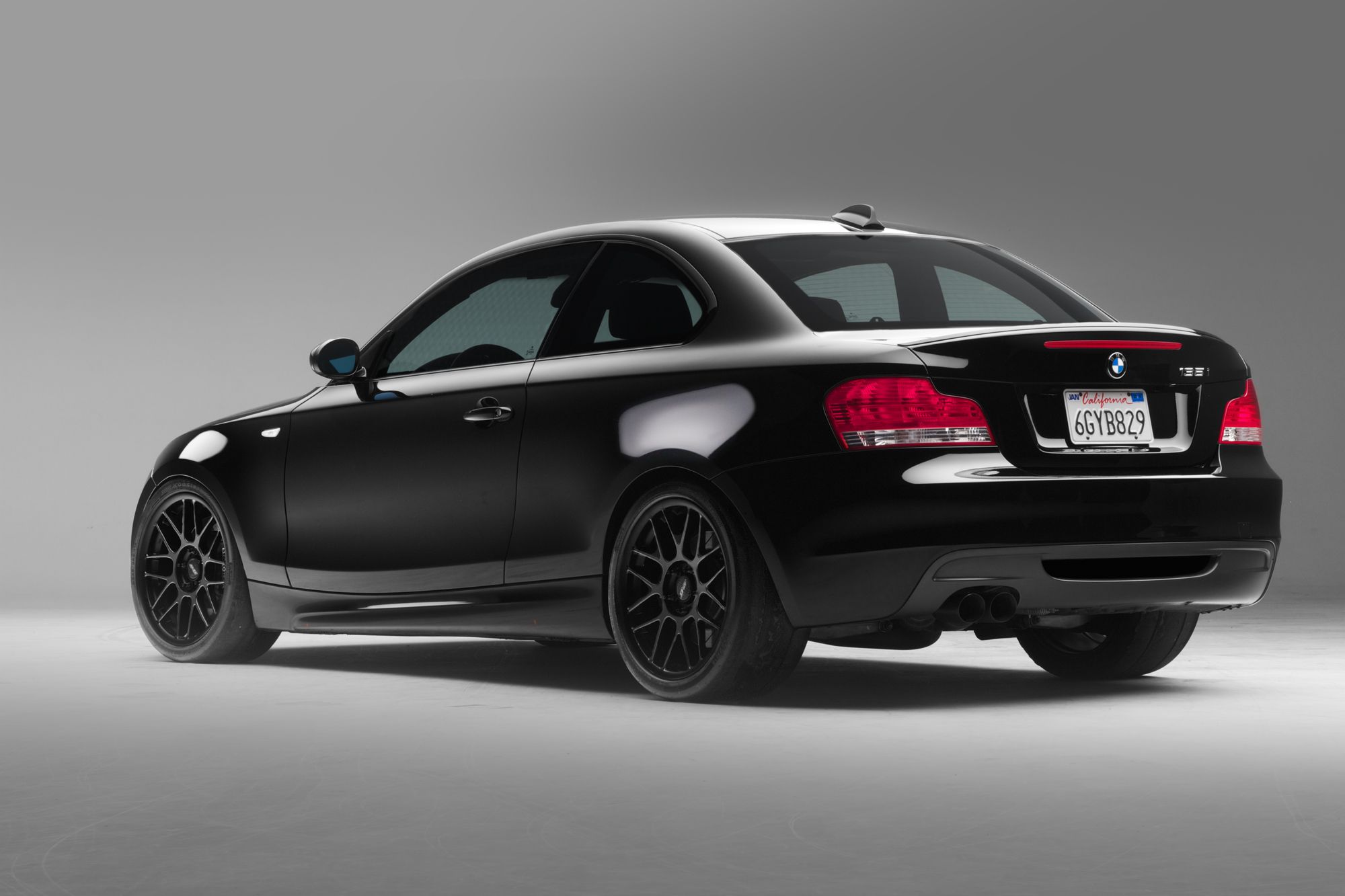 Black BMW E82 Coupe 1 Series with 18" ARC-8 Apex wheels in Satin Black