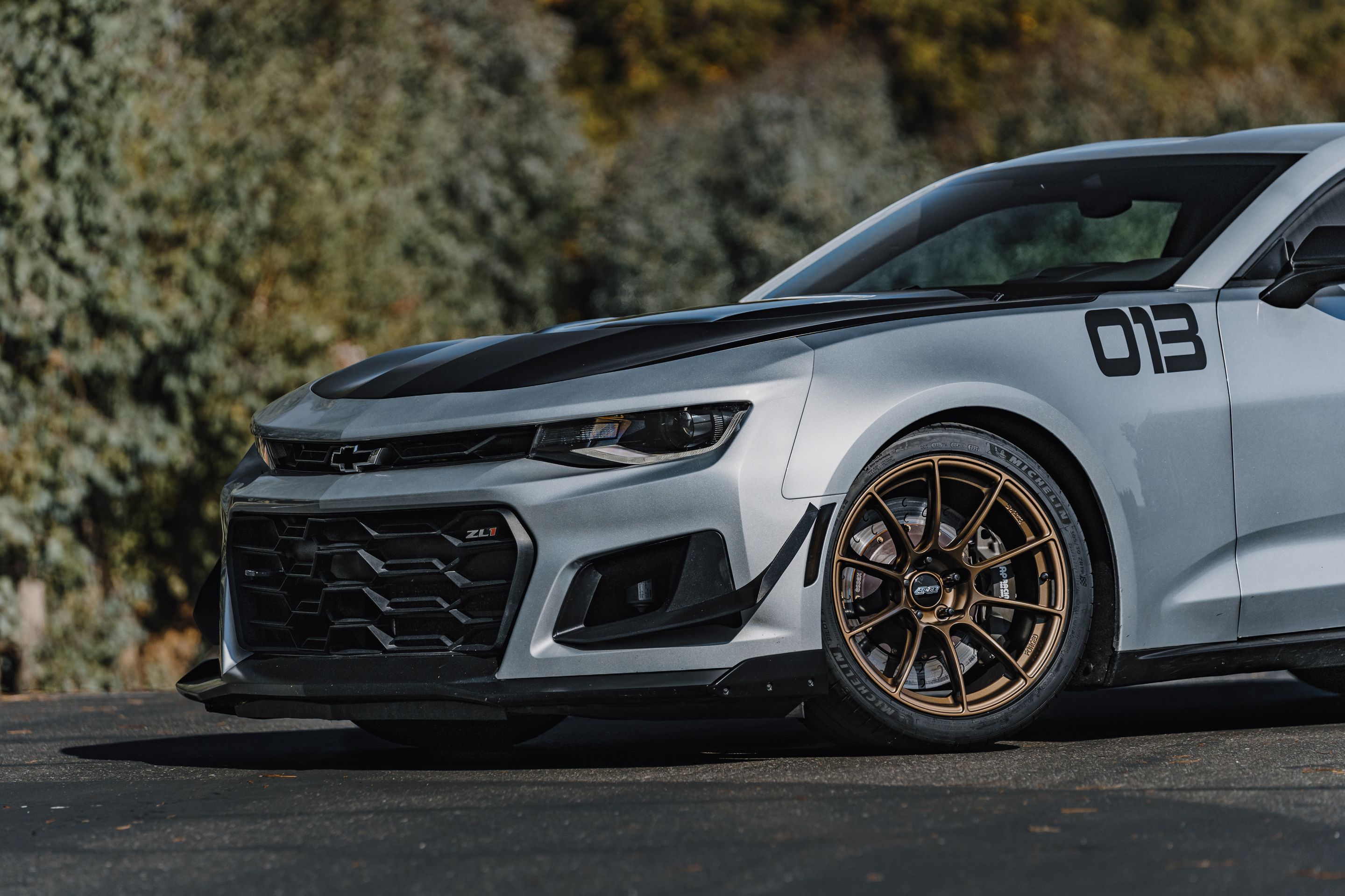 Silver Chevrolet 6th Gen Camaro ZL1 1LE with 19" SM-10RS Apex wheels in Satin Bronze