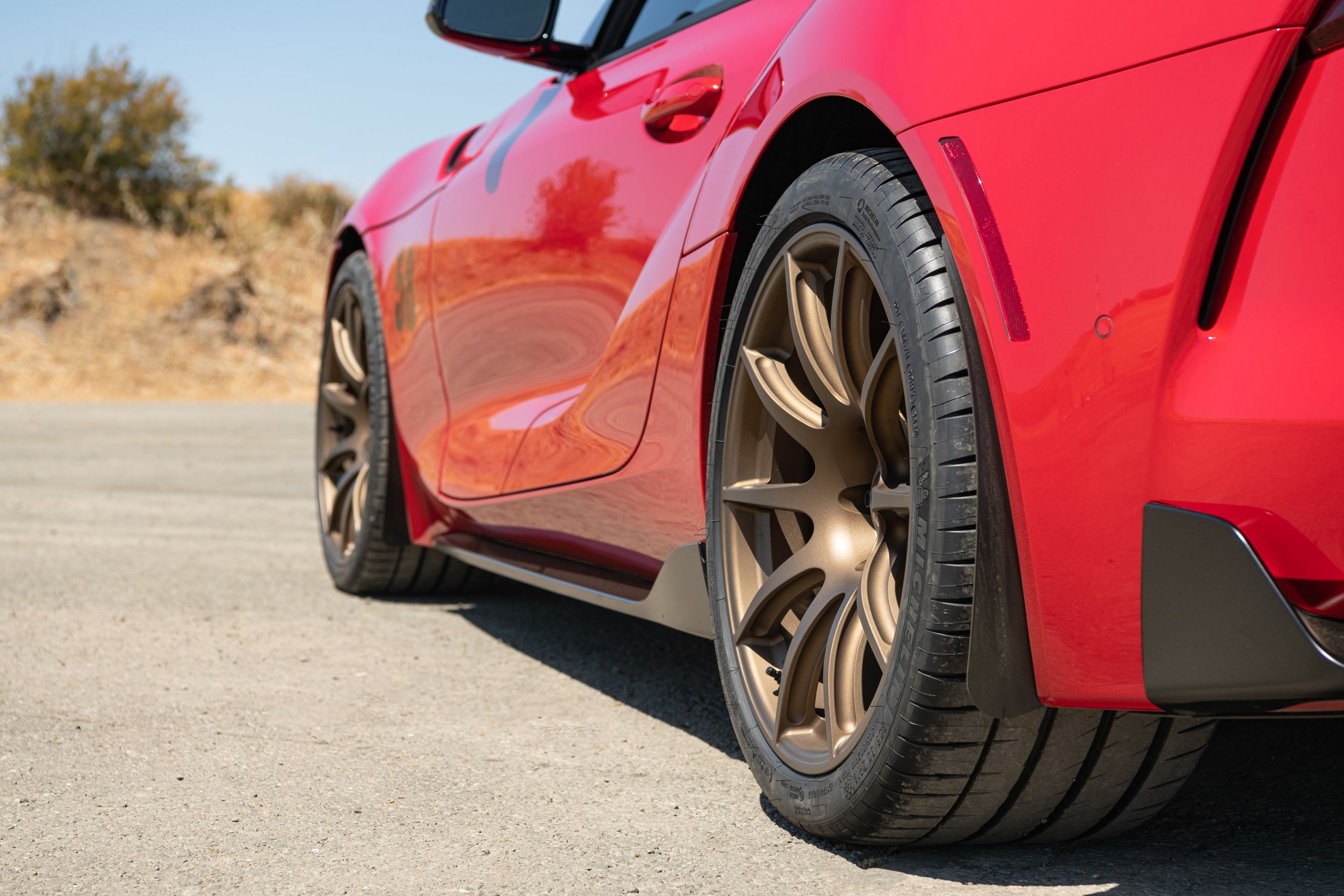 Red Toyota GR Supra with 19" SM-10 Apex wheels in Satin Bronze