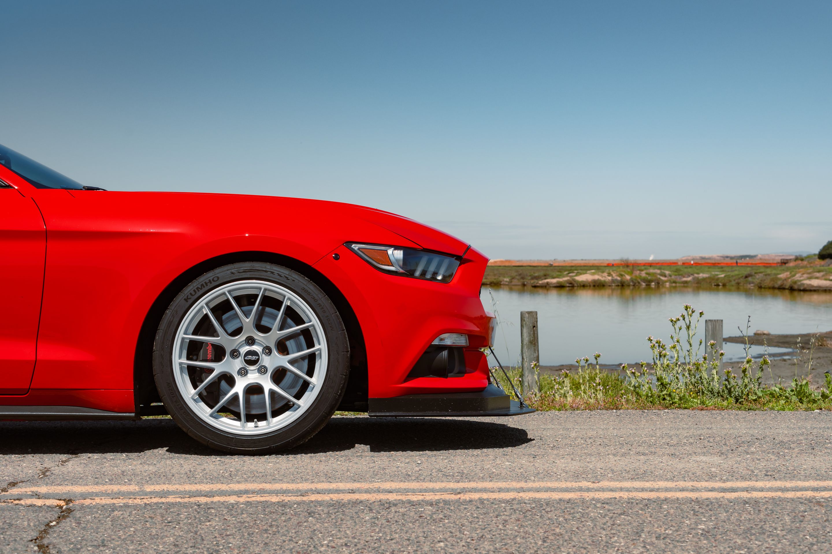Red Ford S550 Mustang GT with 19" EC-7 Apex wheels in Race Silver