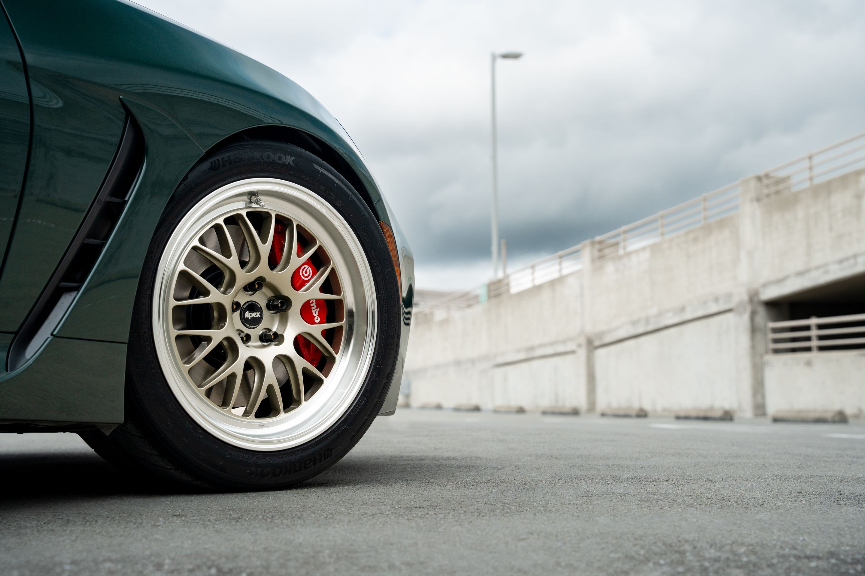 Green Toyota GR86 with 17" ML-10RT Apex wheels in Machined Lip Gloss Motorsport Gold