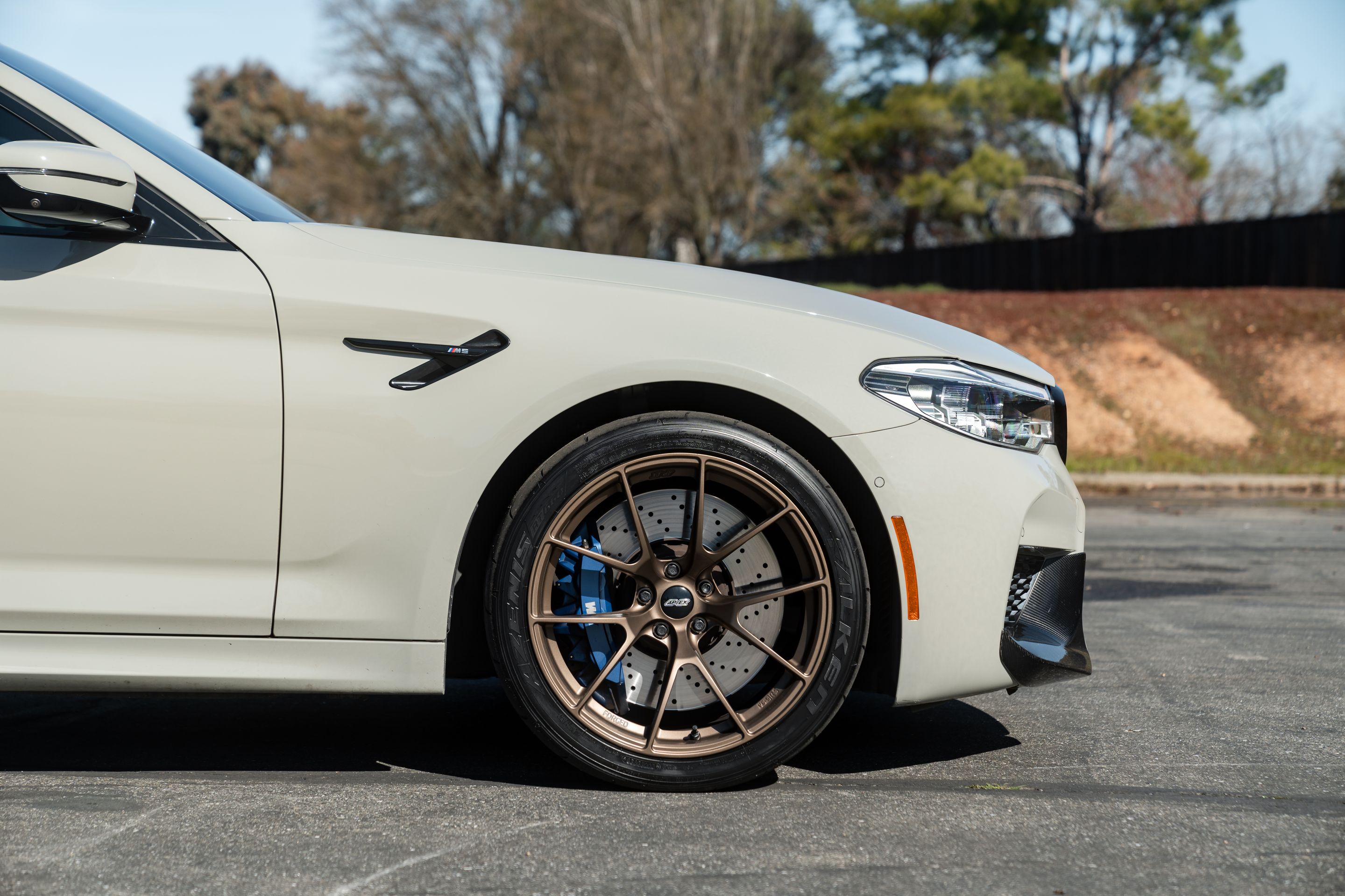 Grey BMW F90 M5 with 19" VS-5RS Apex wheels in Satin Bronze
