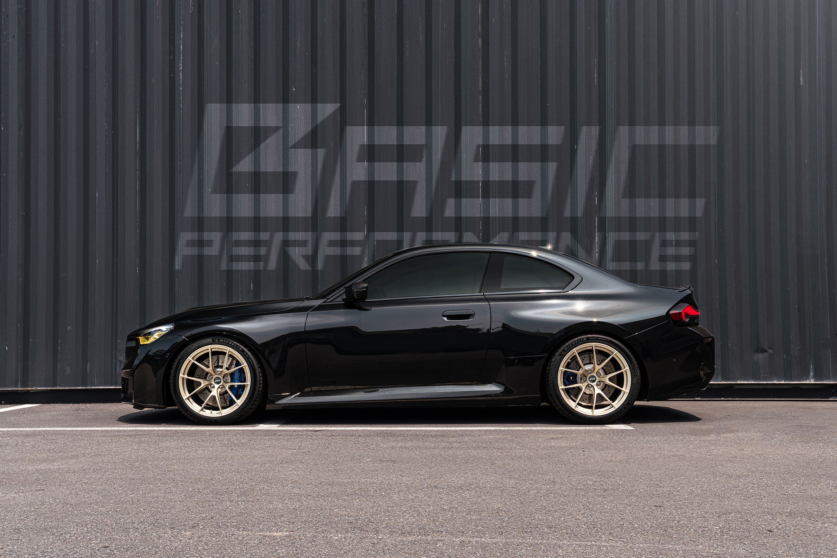 Black BMW G87 M2 with 19" VS-5RS Apex wheels in Motorsport Gold