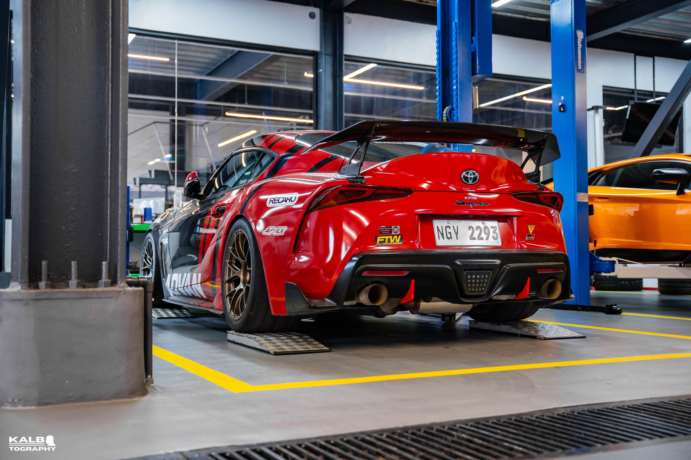 Black Toyota GR Supra with 18" EC-7RS Apex wheels in Satin Bronze