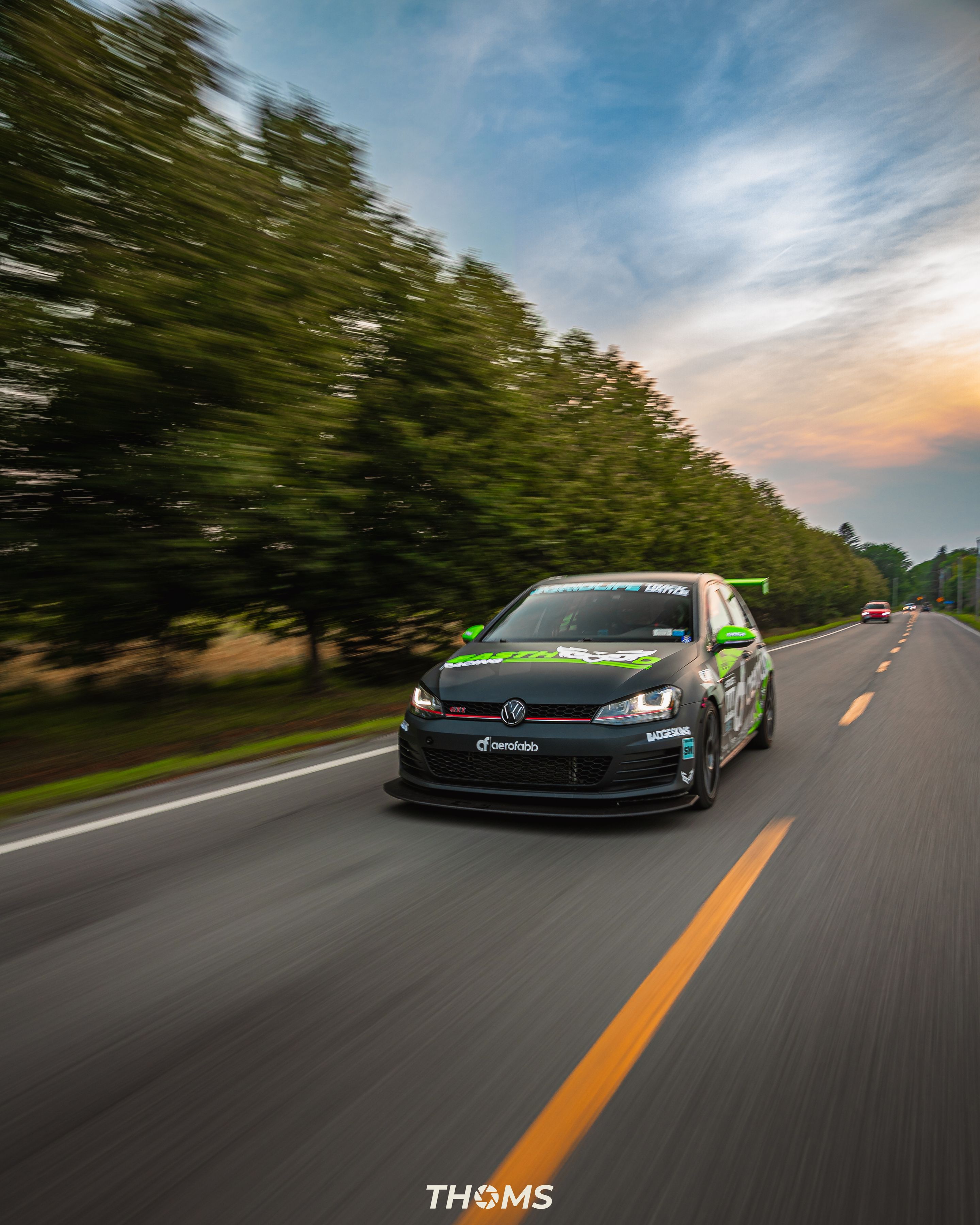 Race Livery VW MK7 GTI with 18" SM-10 Apex wheels in Satin Black
