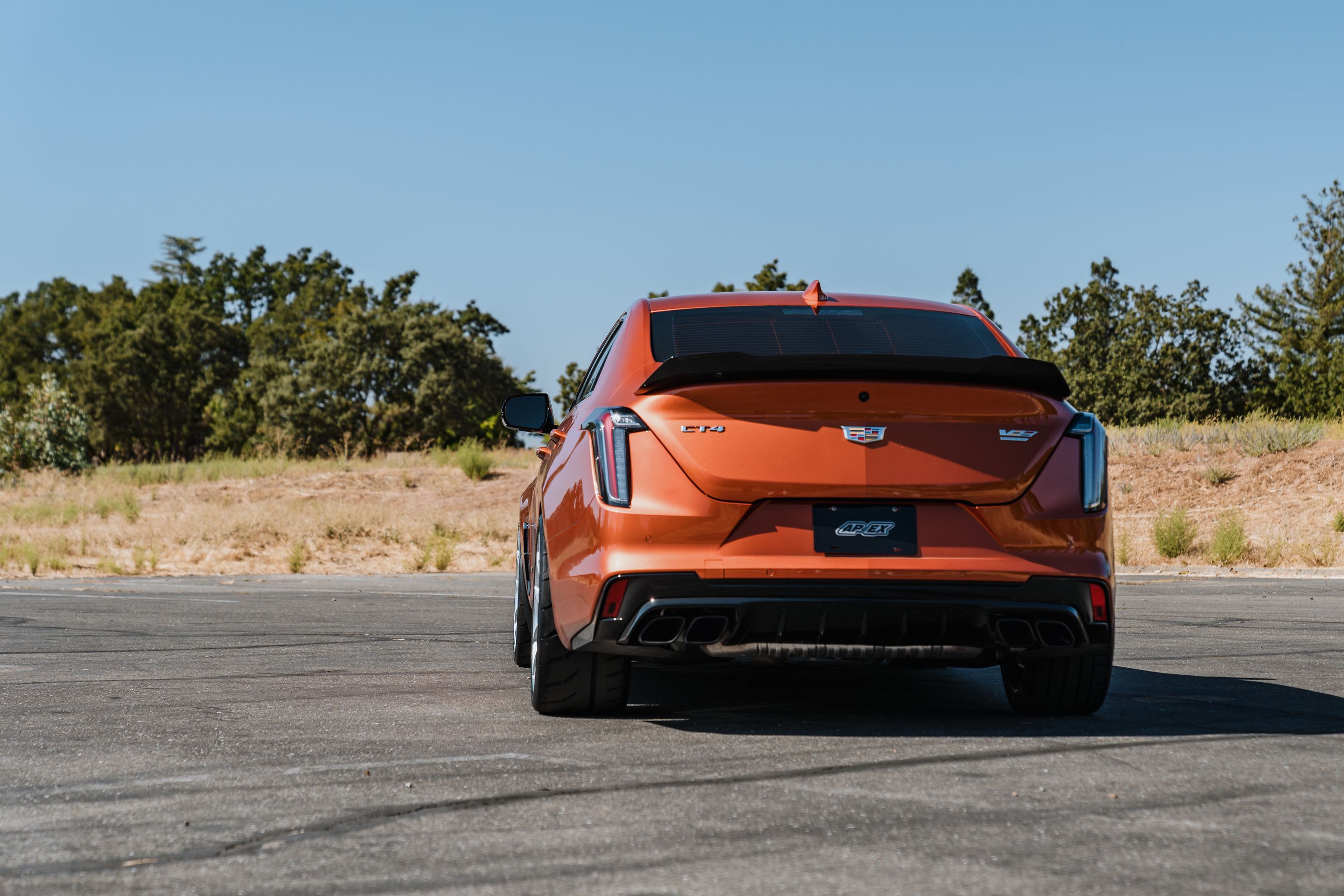 Orange Cadillac CT4-V Blackwing with 19" VS-5RS Apex wheels in Brushed Clear