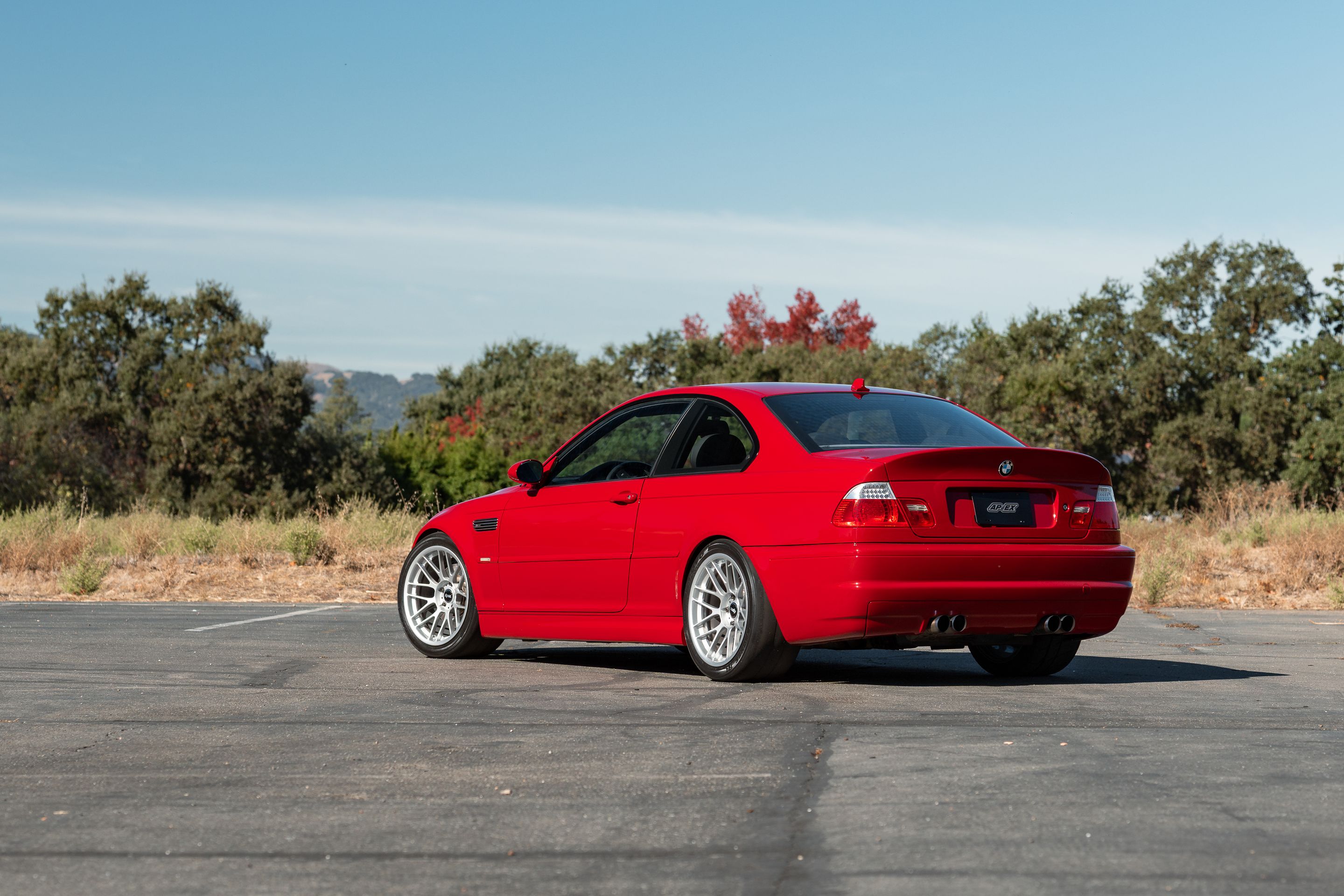 Red BMW E46 M3 with 18" ARC-8RT Apex wheels in Race Silver