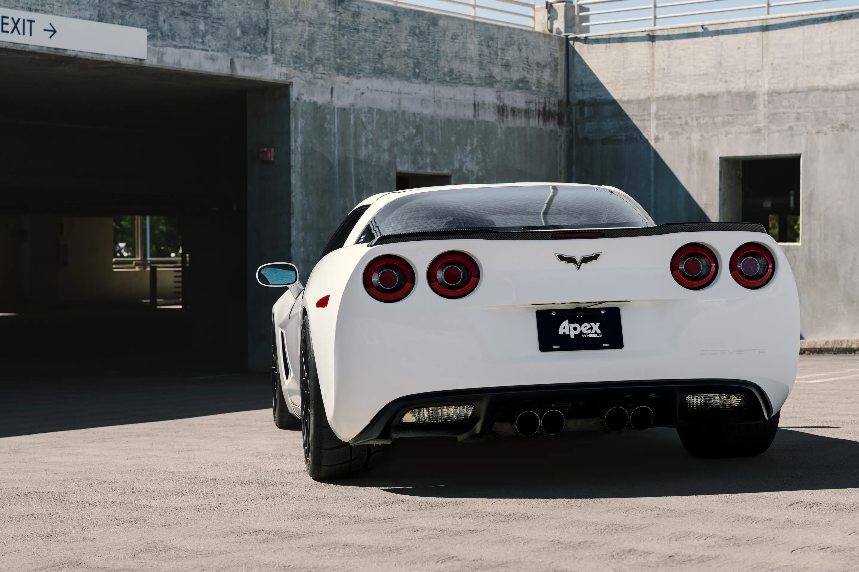 White Chevrolet C6 Corvette Base/Z51 with 18" VS-5 Apex wheels in Satin Black