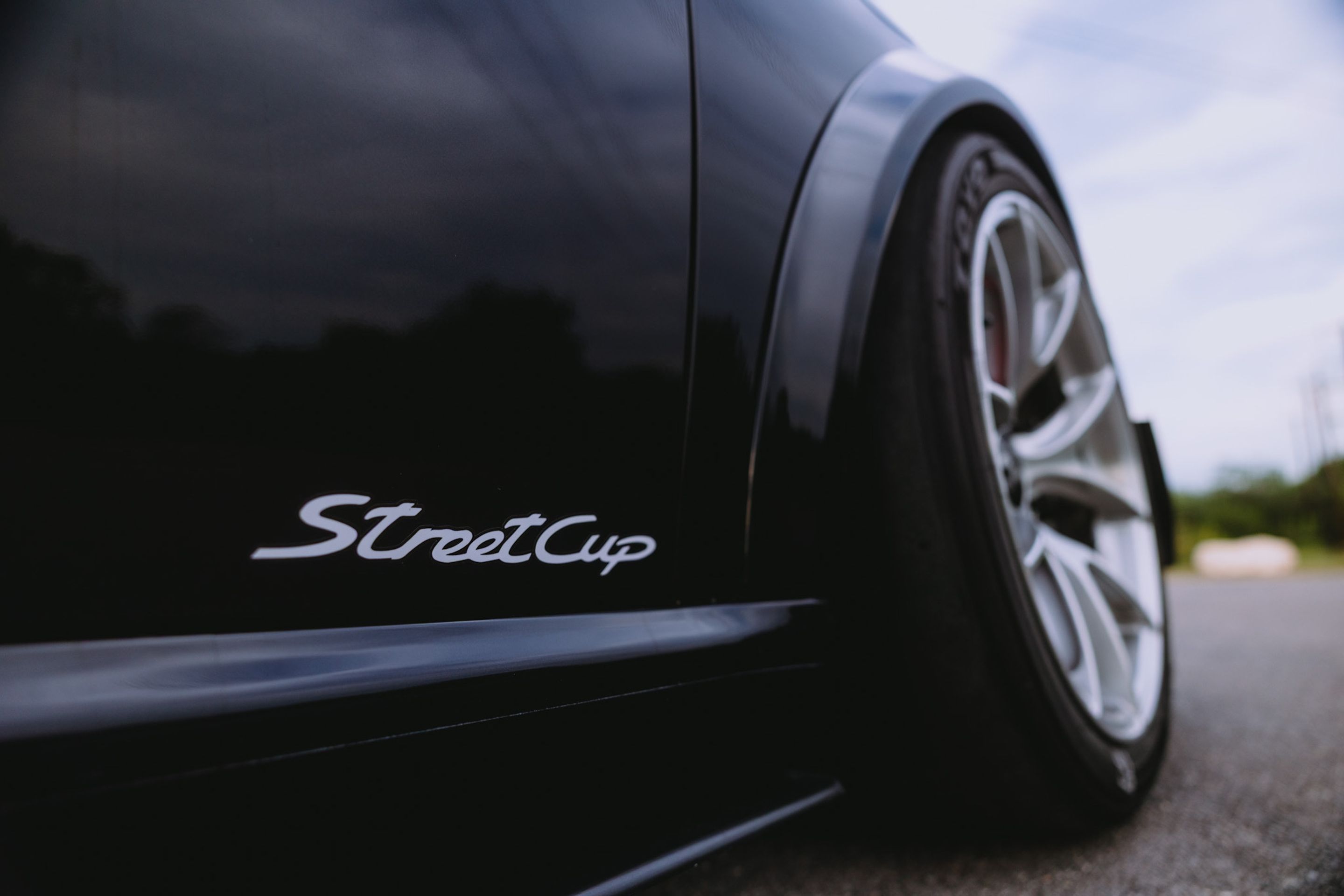 Black Porsche 911 997 Carrera S with 18" VS-5RS Apex wheels in Brushed Clear
