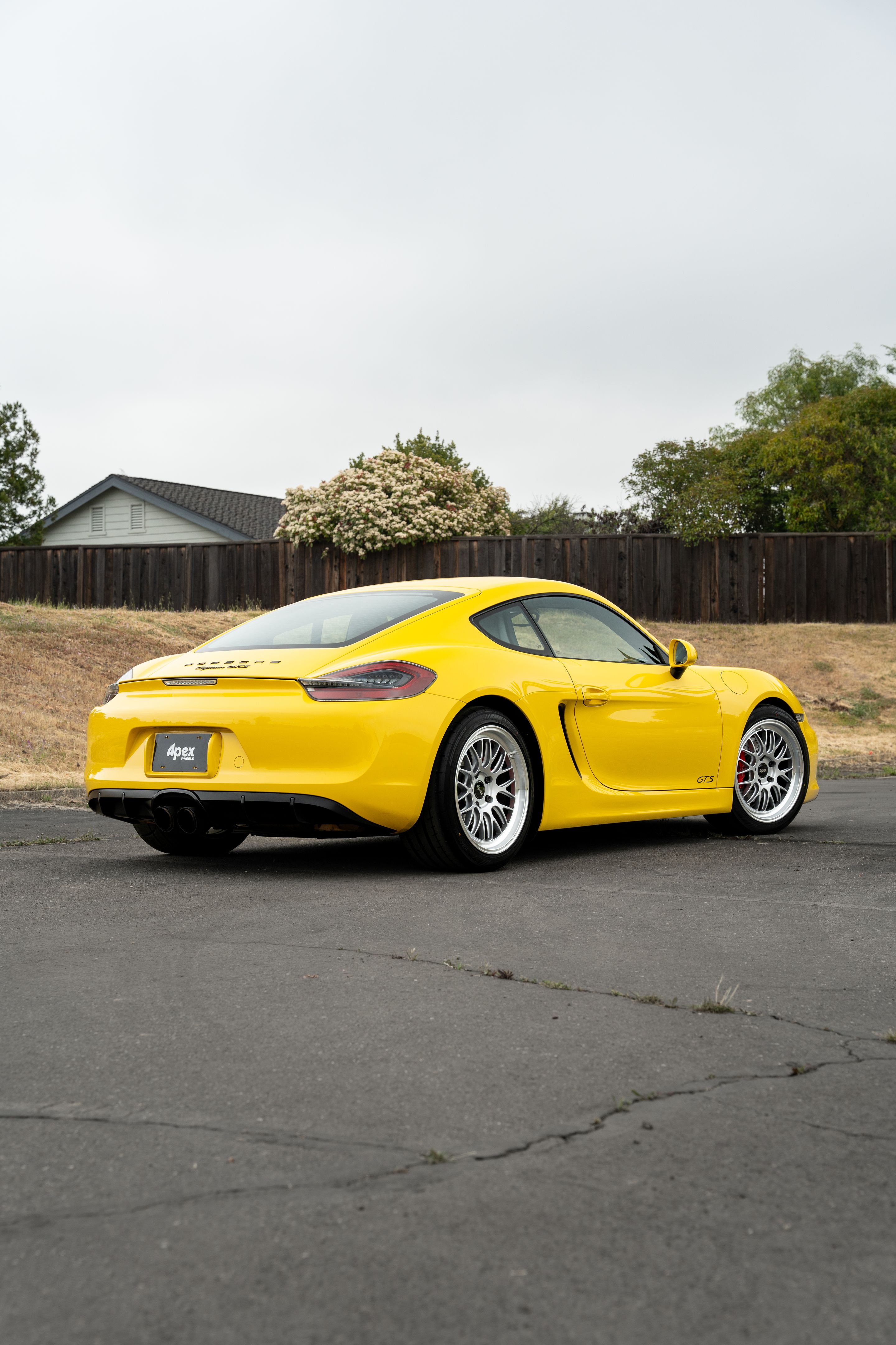 Yellow Porsche 981 Cayman GTS with 19" ML-10RT Apex wheels in Machined Lip Race Silver