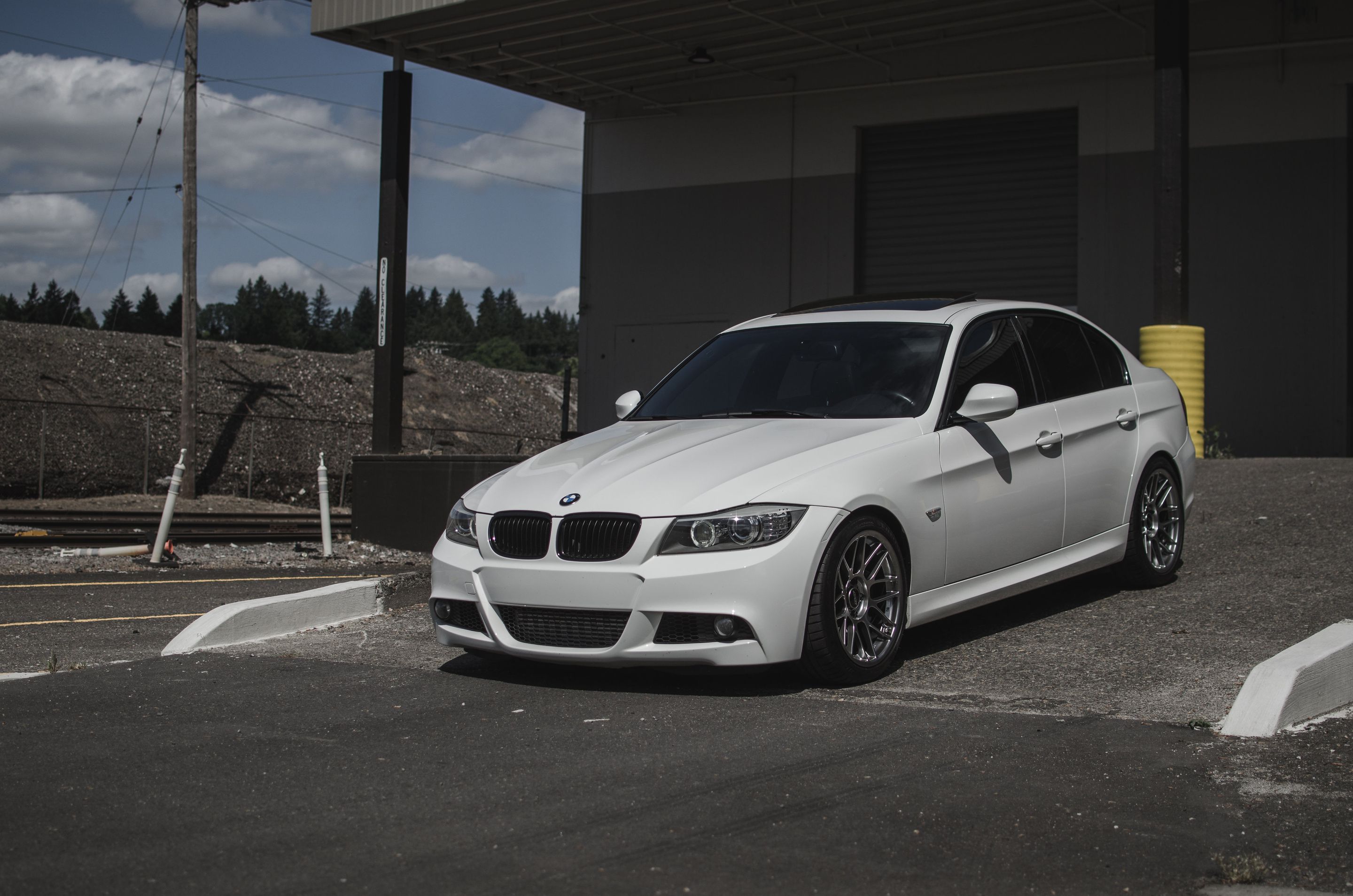 White BMW E90 LCI Sedan 3 Series with 18" ARC-8 Apex wheels in Hyper Black