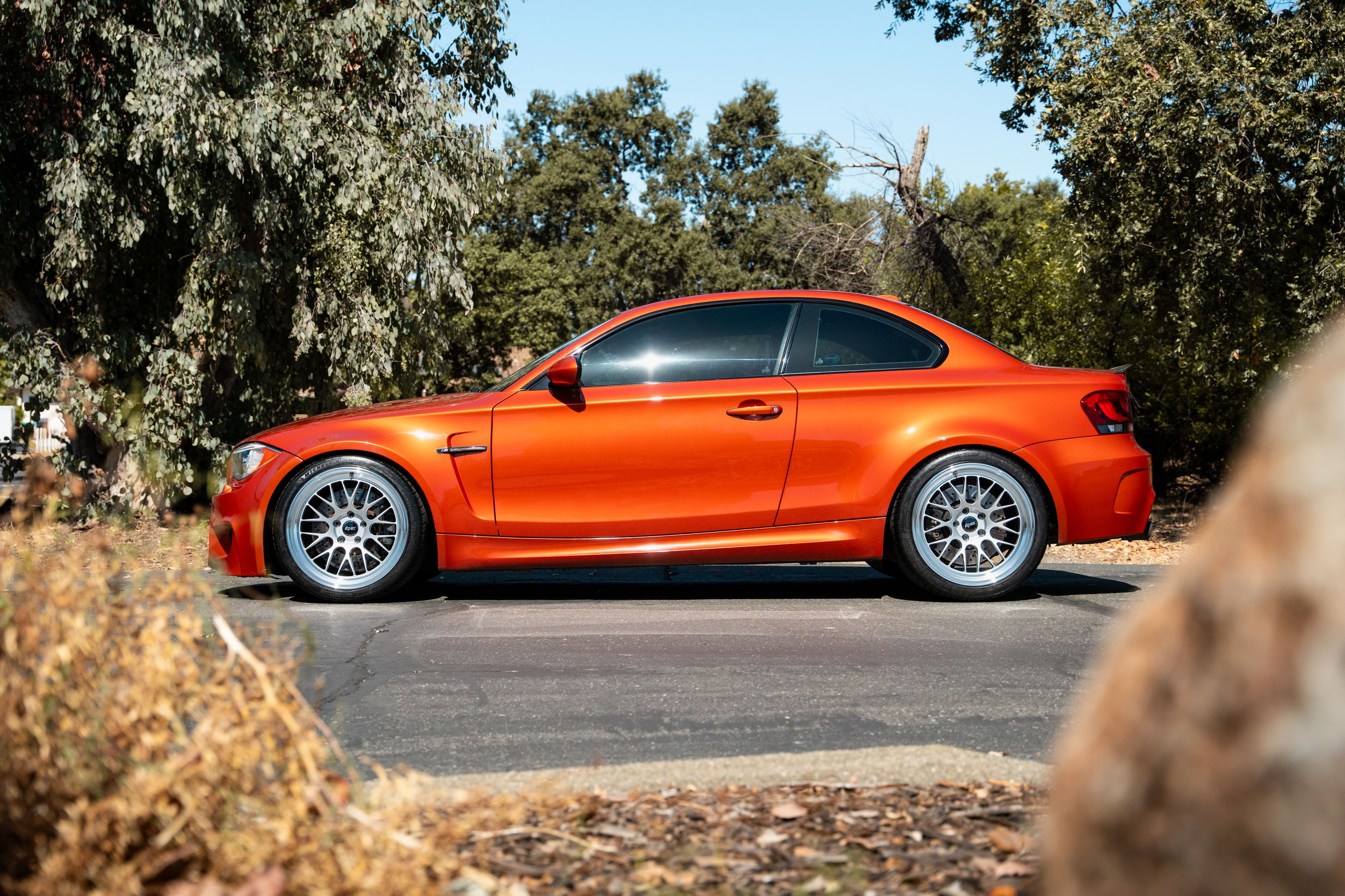Orange BMW E82 1M with 19" ML-10RT Apex wheels in Machined Lip Race Silver