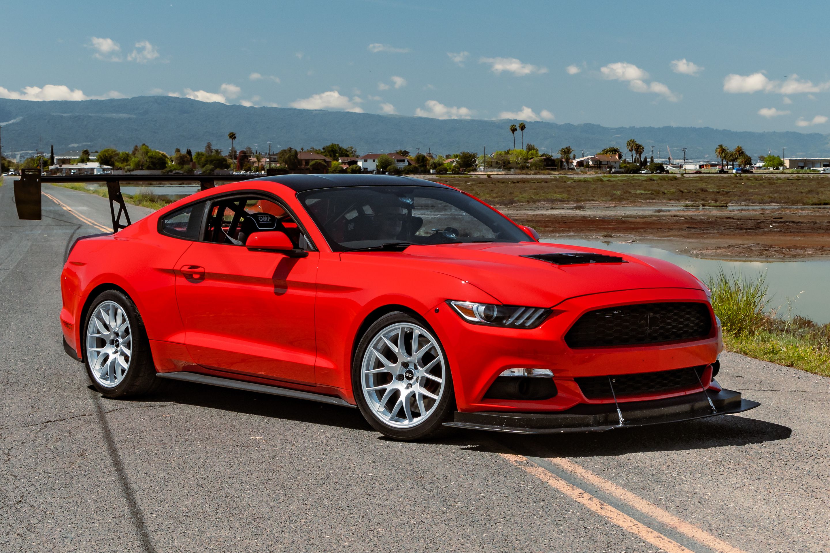 Red Ford S550 Mustang GT with 19" EC-7 Apex wheels in Race Silver