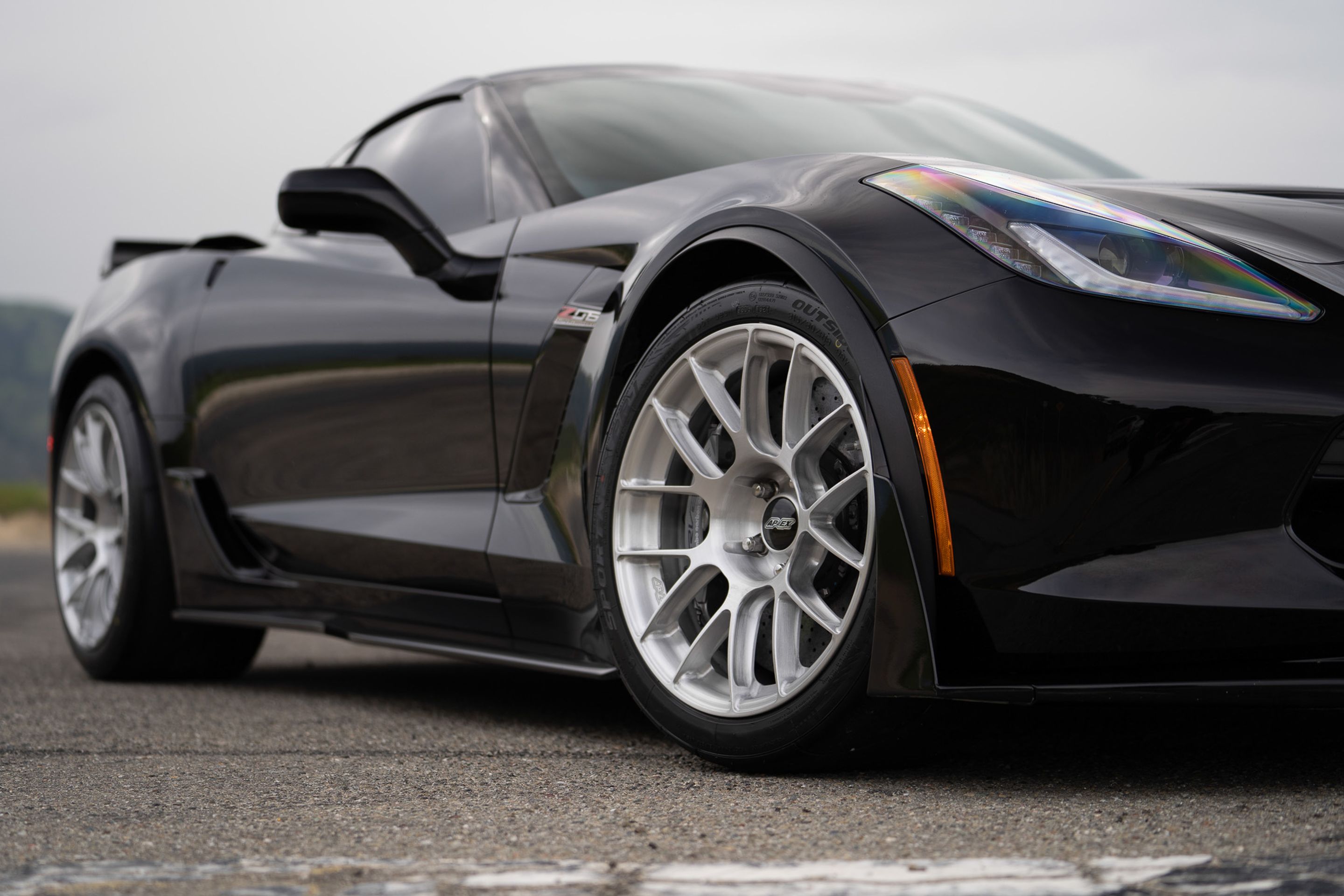 Black Chevrolet C7 Corvette Z06 with 18"/19" EC-7RS Apex wheels in Brushed Clear