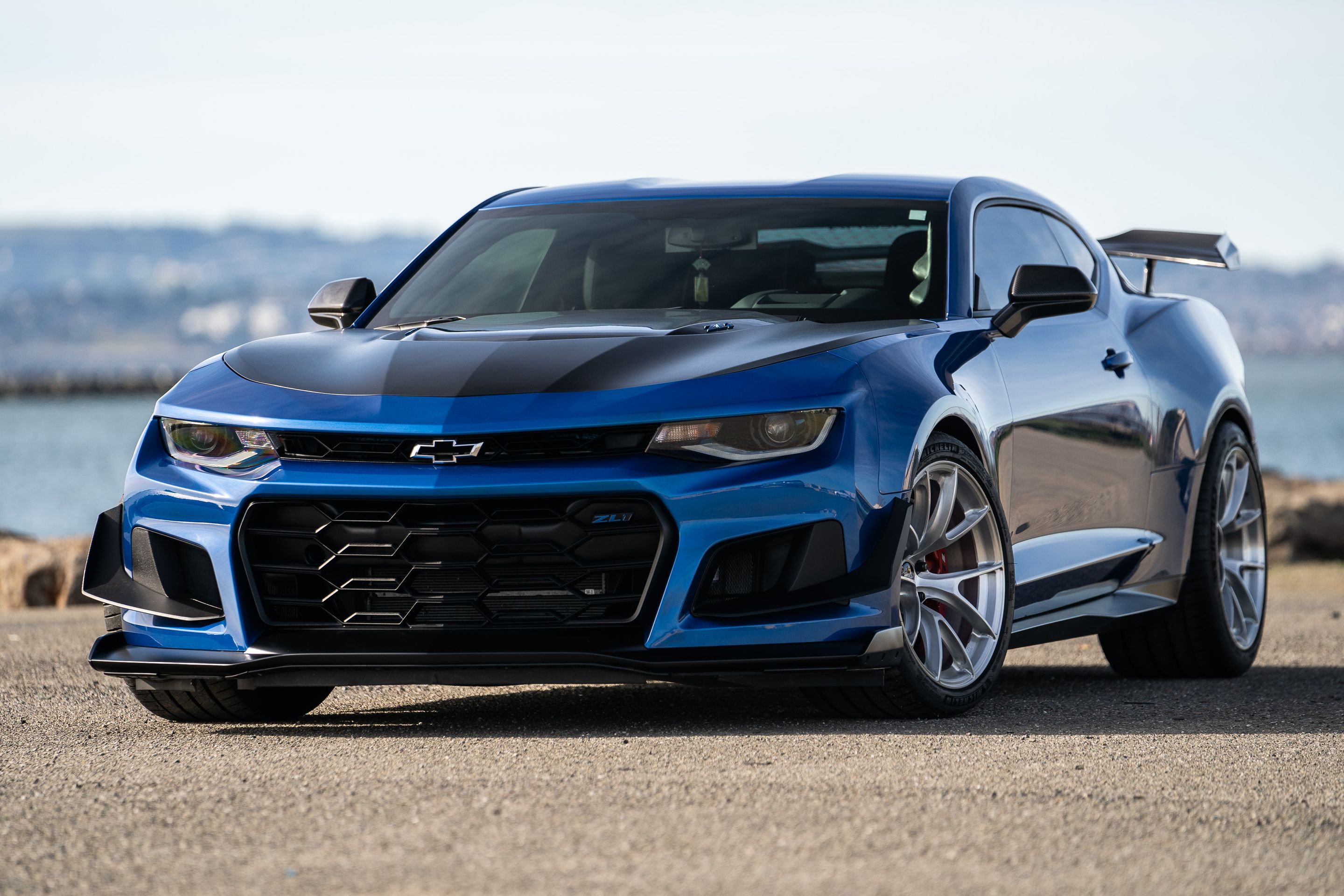 Blue Chevrolet 6th Gen Camaro ZL1 1LE with 19" VS-5RS Apex wheels in Brushed Clear