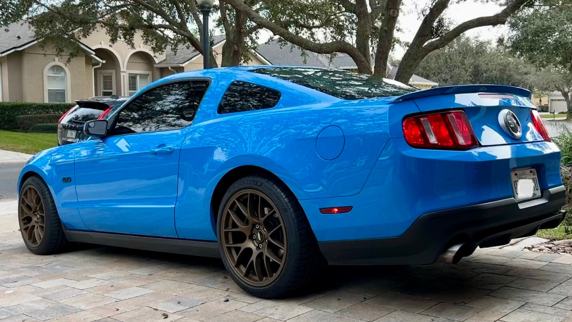 Blue Ford S197 Mustang GT with 19" EC-7 Apex wheels in Satin Bronze