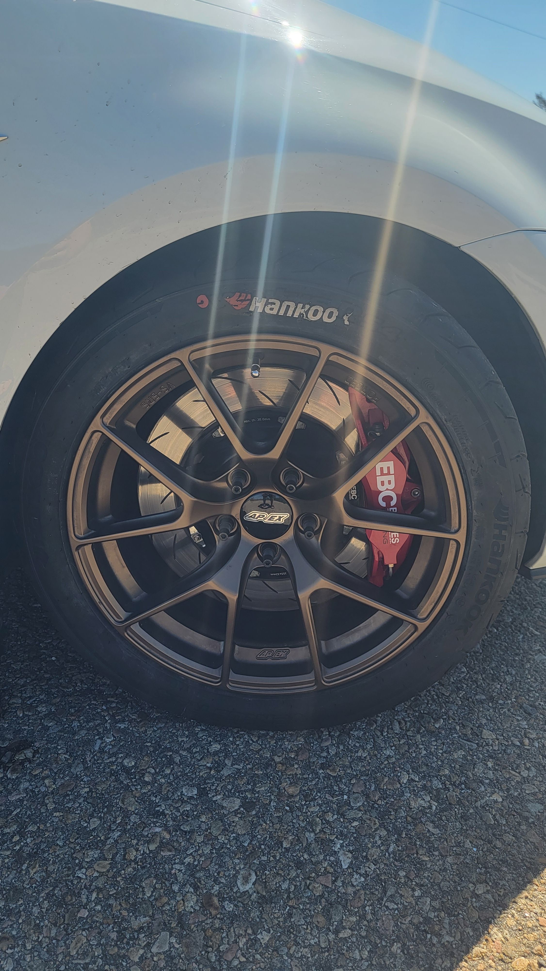 White VW MK7 GTI with 17" VS-5RS Apex wheels in Satin Bronze