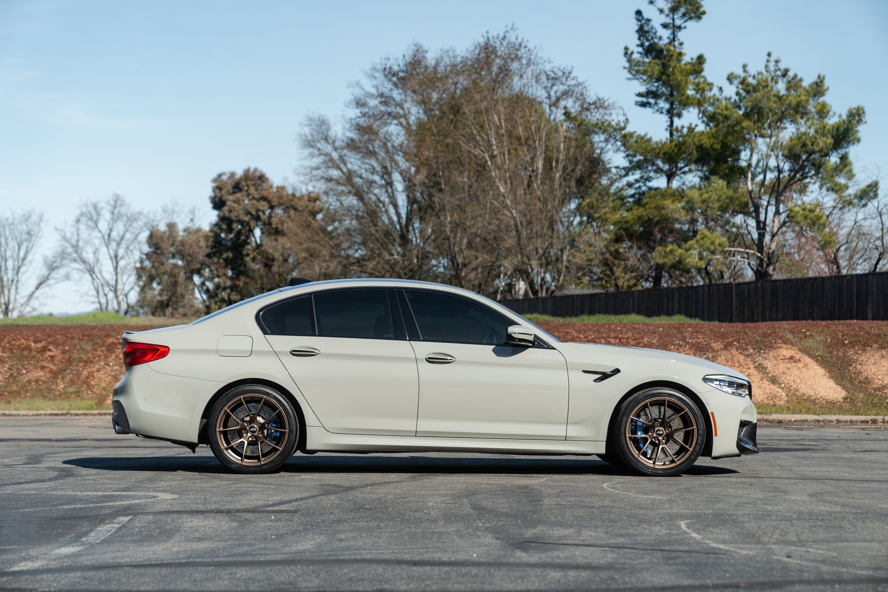 Grey BMW F90 M5 with 19" VS-5RS Apex wheels in Satin Bronze
