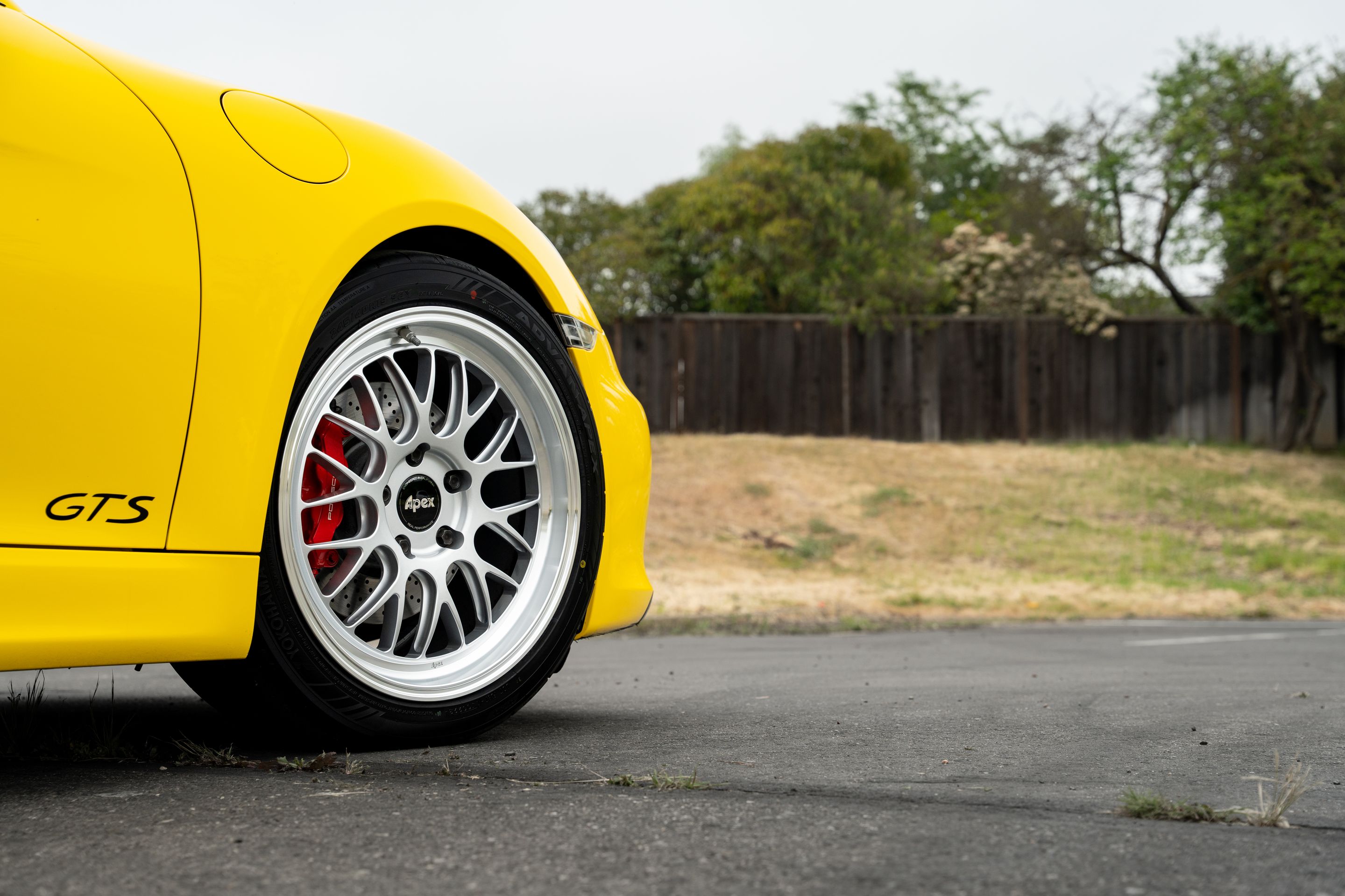 Yellow Porsche 981 Cayman GTS with 19" ML-10RT Apex wheels in Machined Lip Race Silver