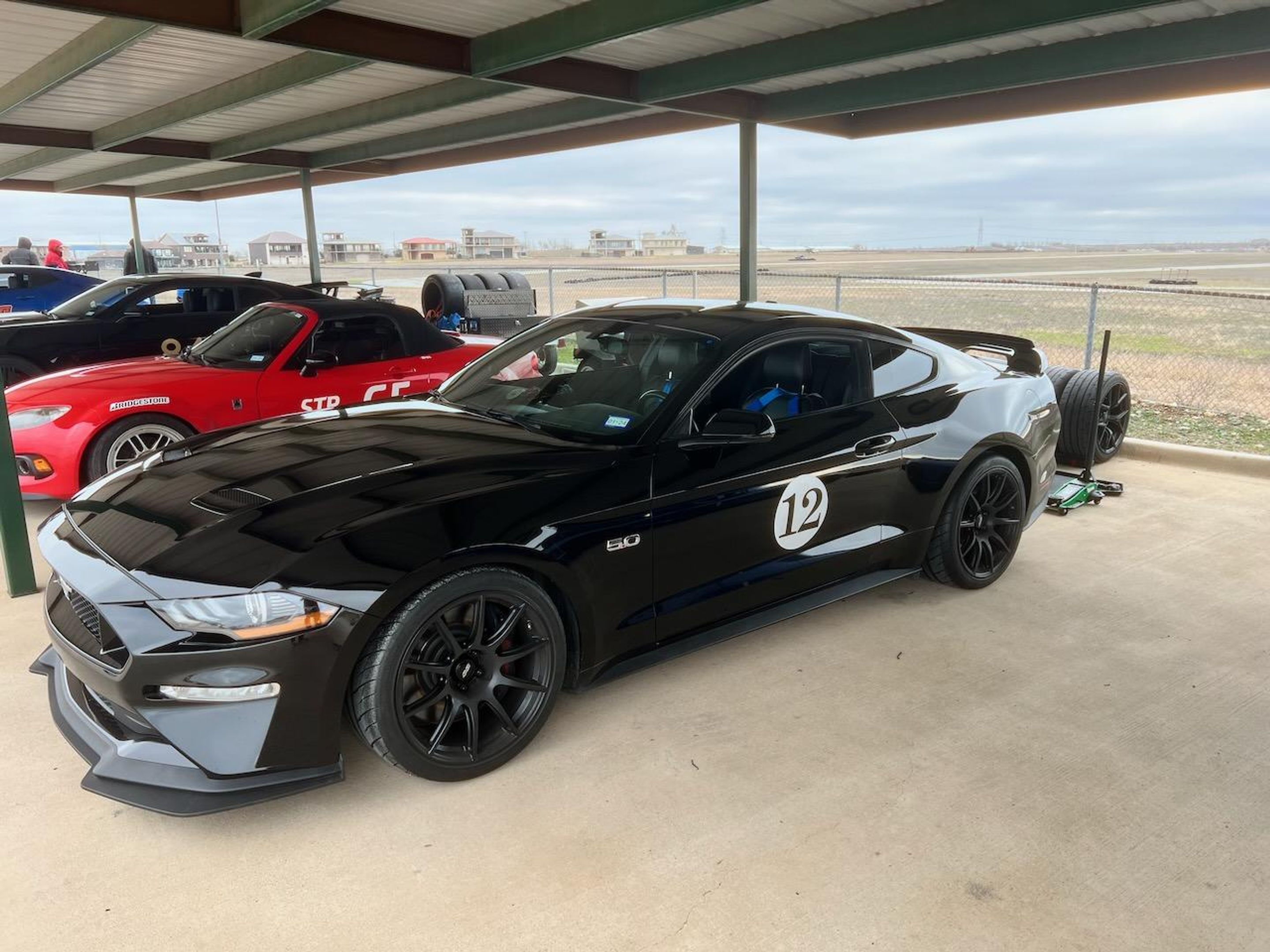 Black Ford S550 Mustang GT with 19" SM-10 Apex wheels in Satin Black
