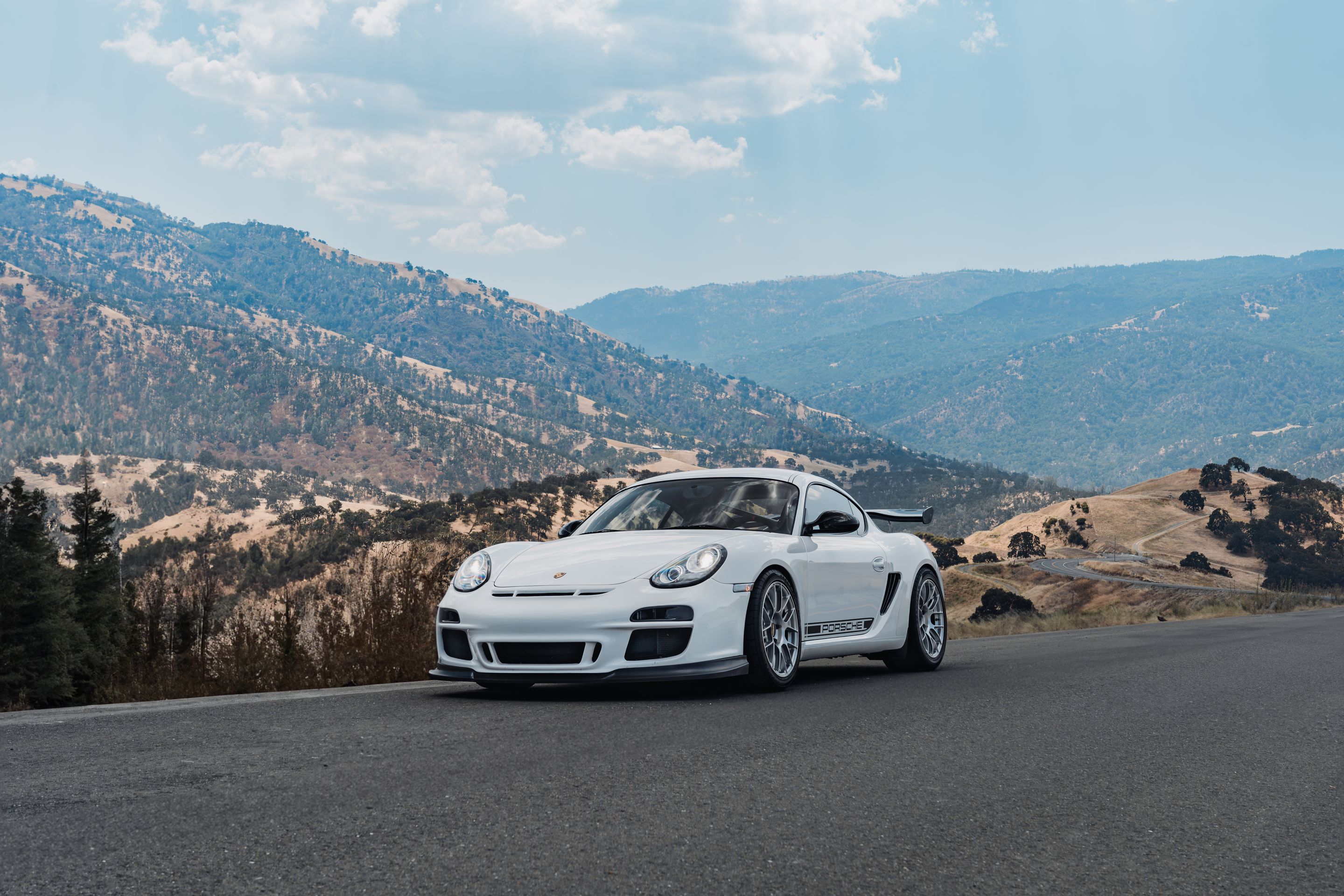 White Porsche 987 Cayman R with 18" EC-7RS Apex wheels in Race Silver