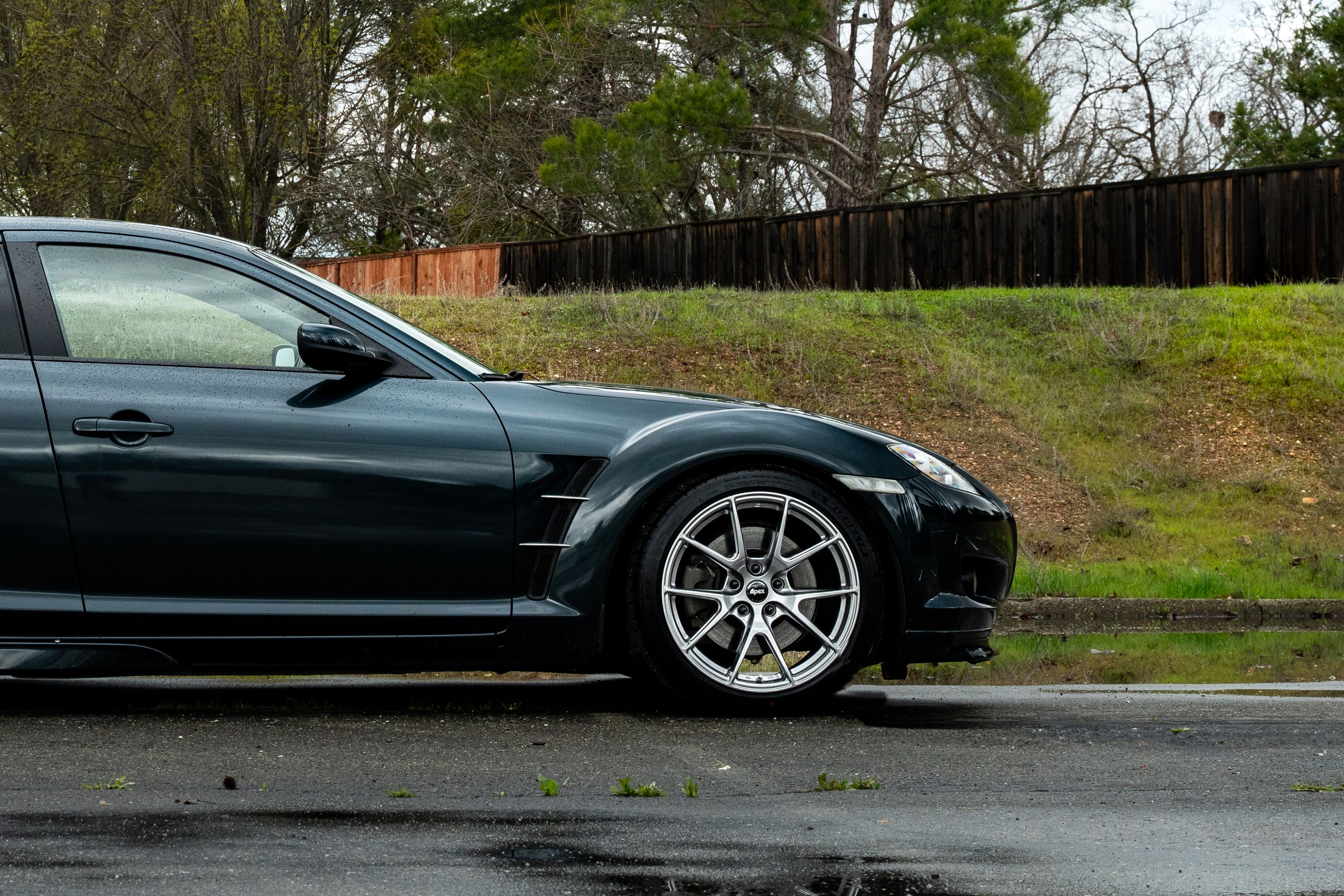 Green Mazda RX-8 with 18" VS-5 Apex wheels in Hyper Black