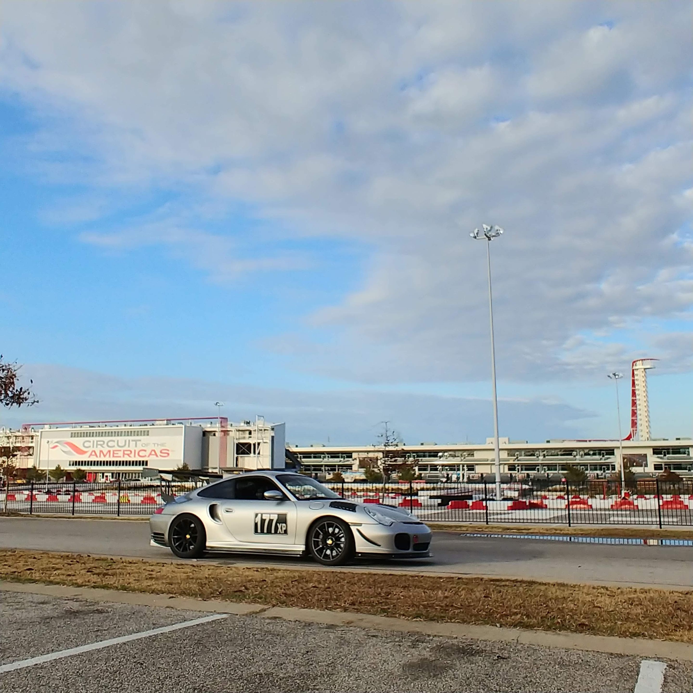 Silver Porsche 911 996 Turbo with 18" SM-10 Apex wheels in Satin Black
