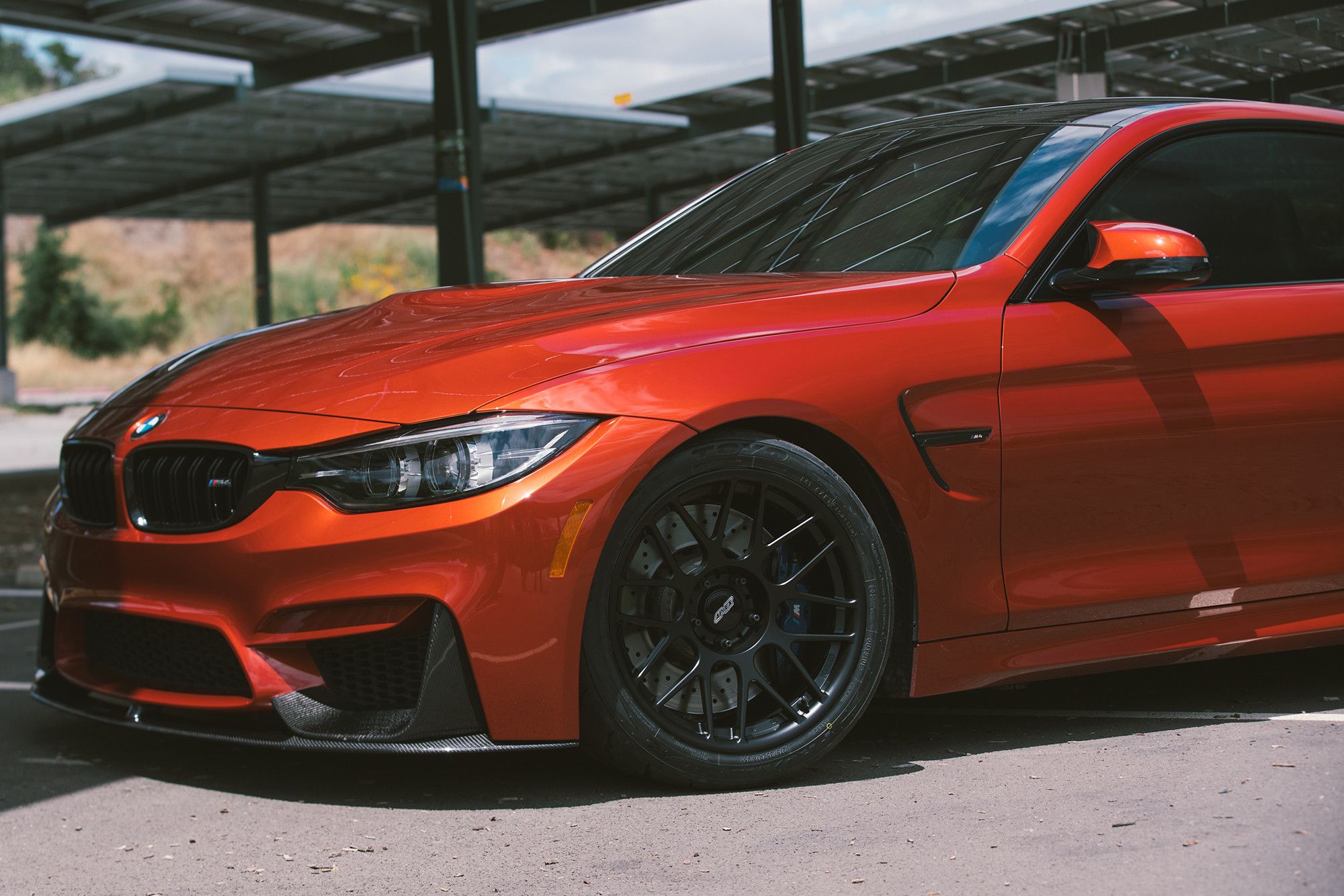 Red BMW F82 Coupe M4 with 18" ARC-8R Apex wheels in Satin Black