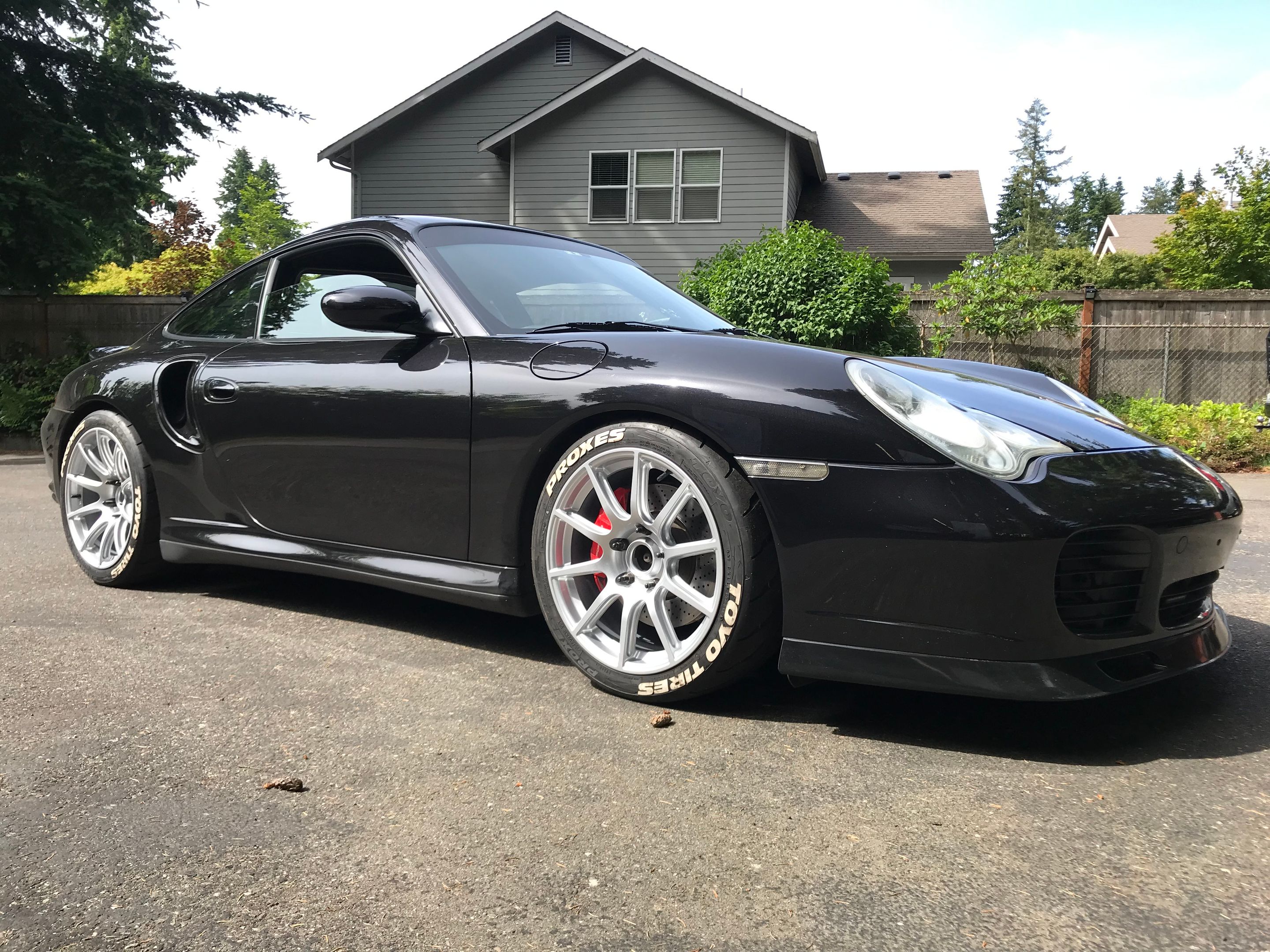 Black Porsche 911 996 Turbo with 18" SM-10 Apex wheels in Race Silver