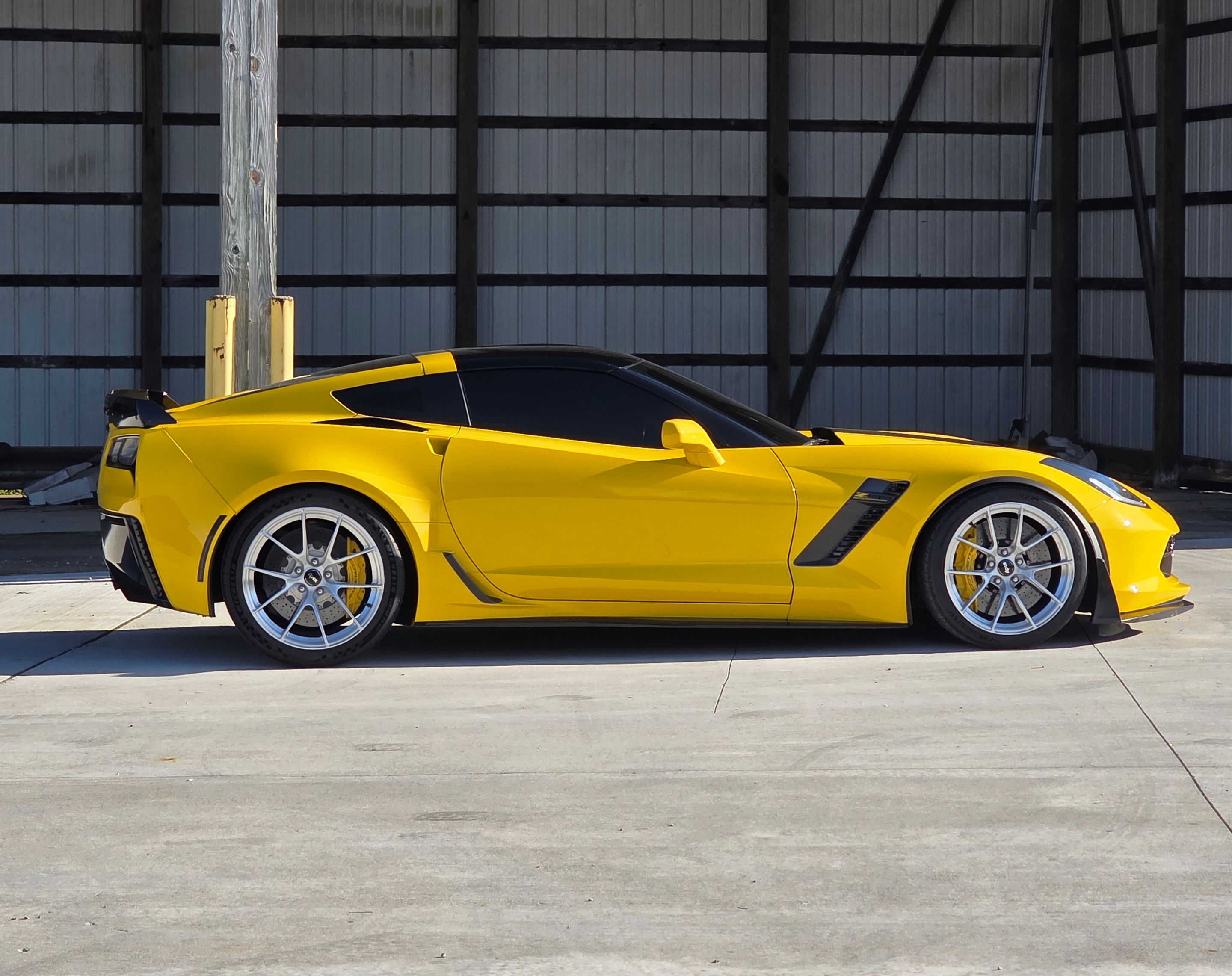 Yellow Chevrolet C7 Corvette Z06 with 19"/20" VS-5RS Apex wheels in Brushed Clear