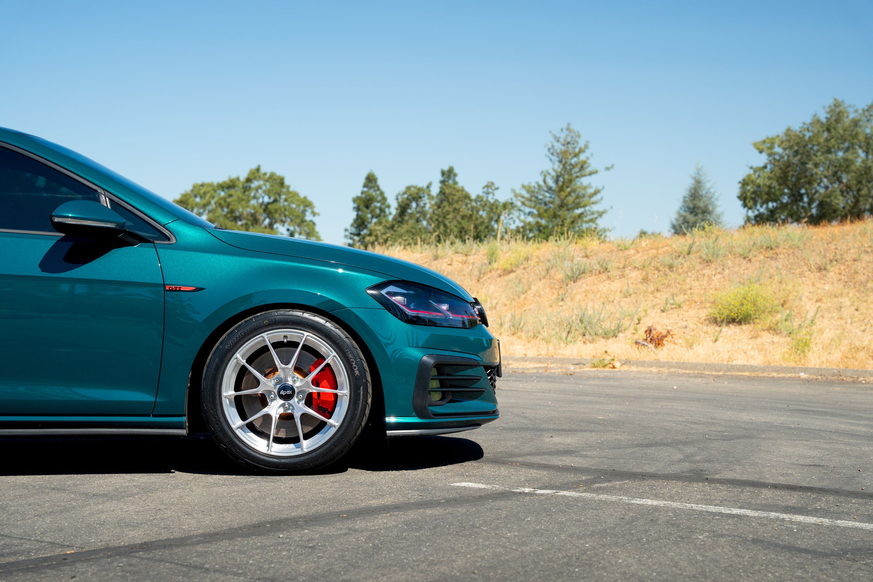 Green VW MK7 GTI with 17" VS-5RS Apex wheels in Brushed Clear