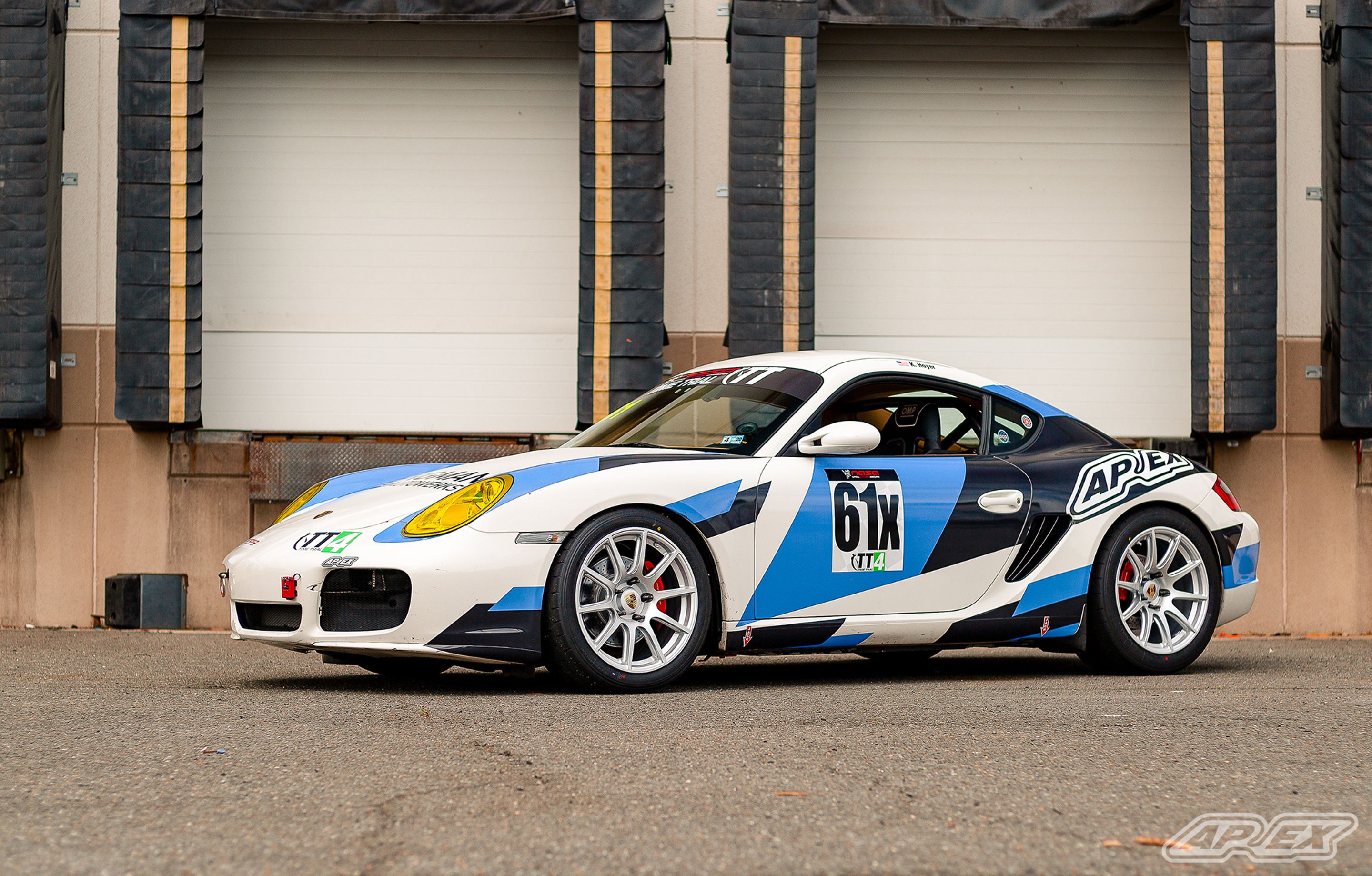 White Porsche 987 Cayman S with 18" SM-10 Apex wheels in Race Silver