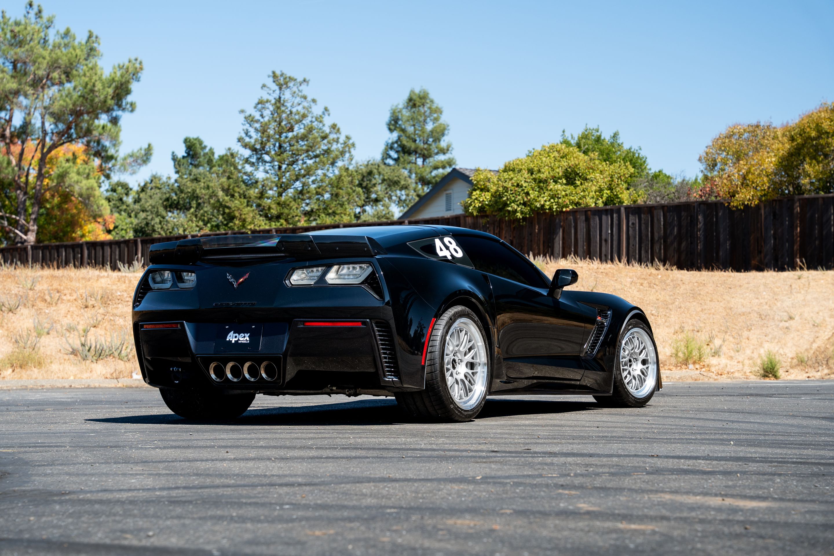 Black Chevrolet C7 Corvette Z06 with 18"/19" ML-10RT Apex wheels in Machined Lip Race Silver