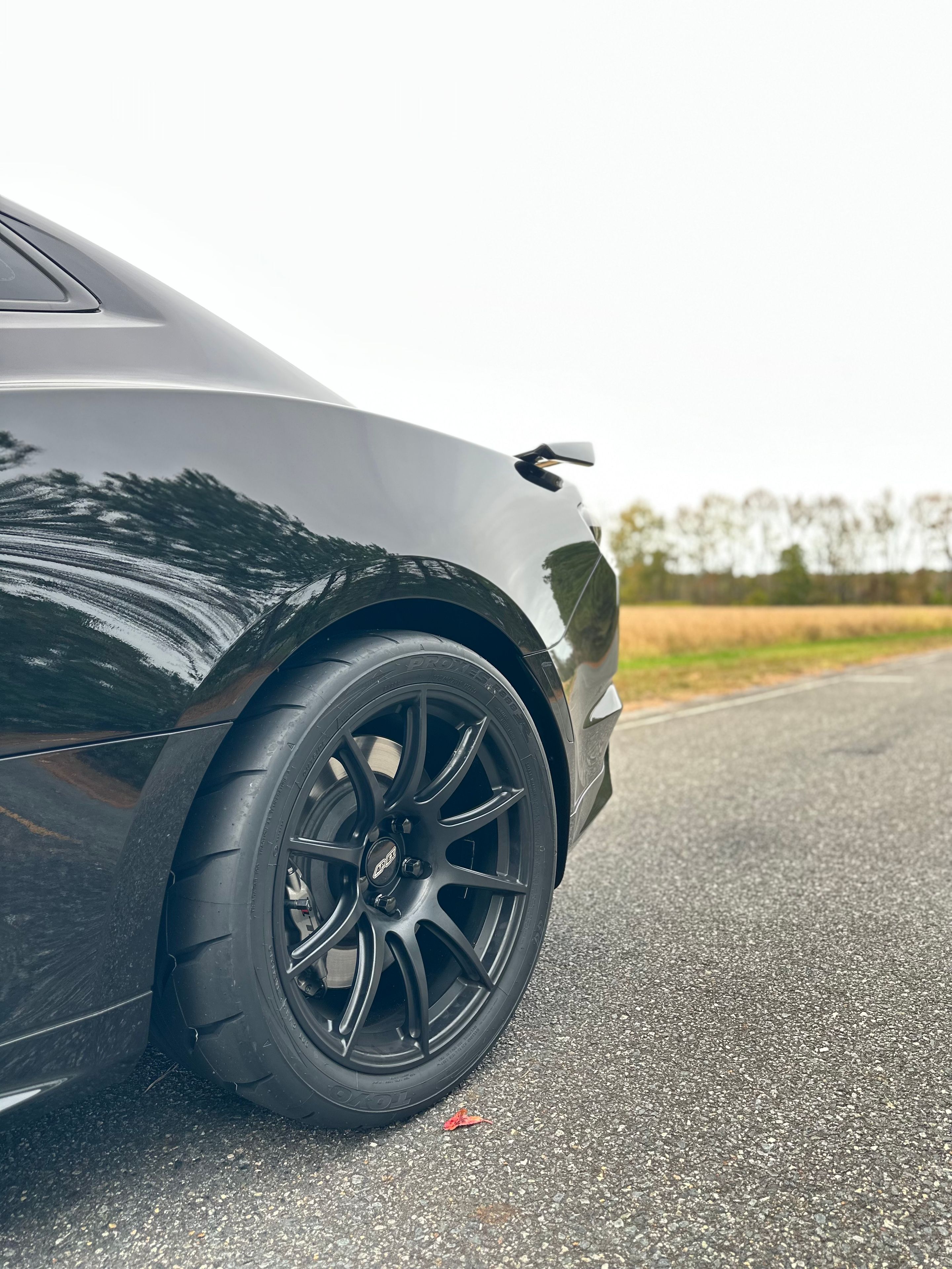 Black Chevrolet 6th Gen Camaro ZL1 with 19" SM-10 Apex wheels in Satin Black