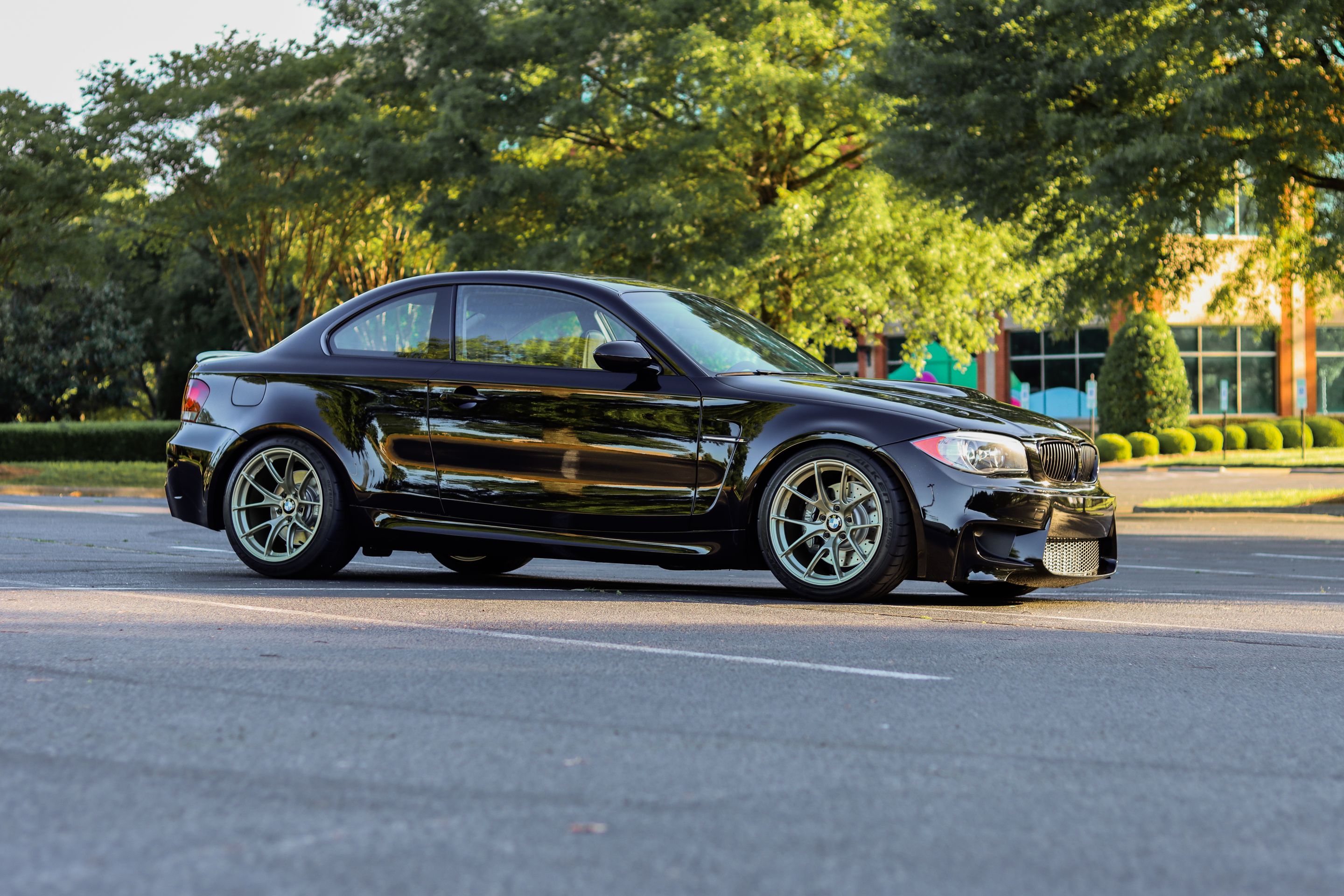 Black BMW E82 Coupe 1 Series with 18" VS-5RS Apex wheels in Motorsport Gold