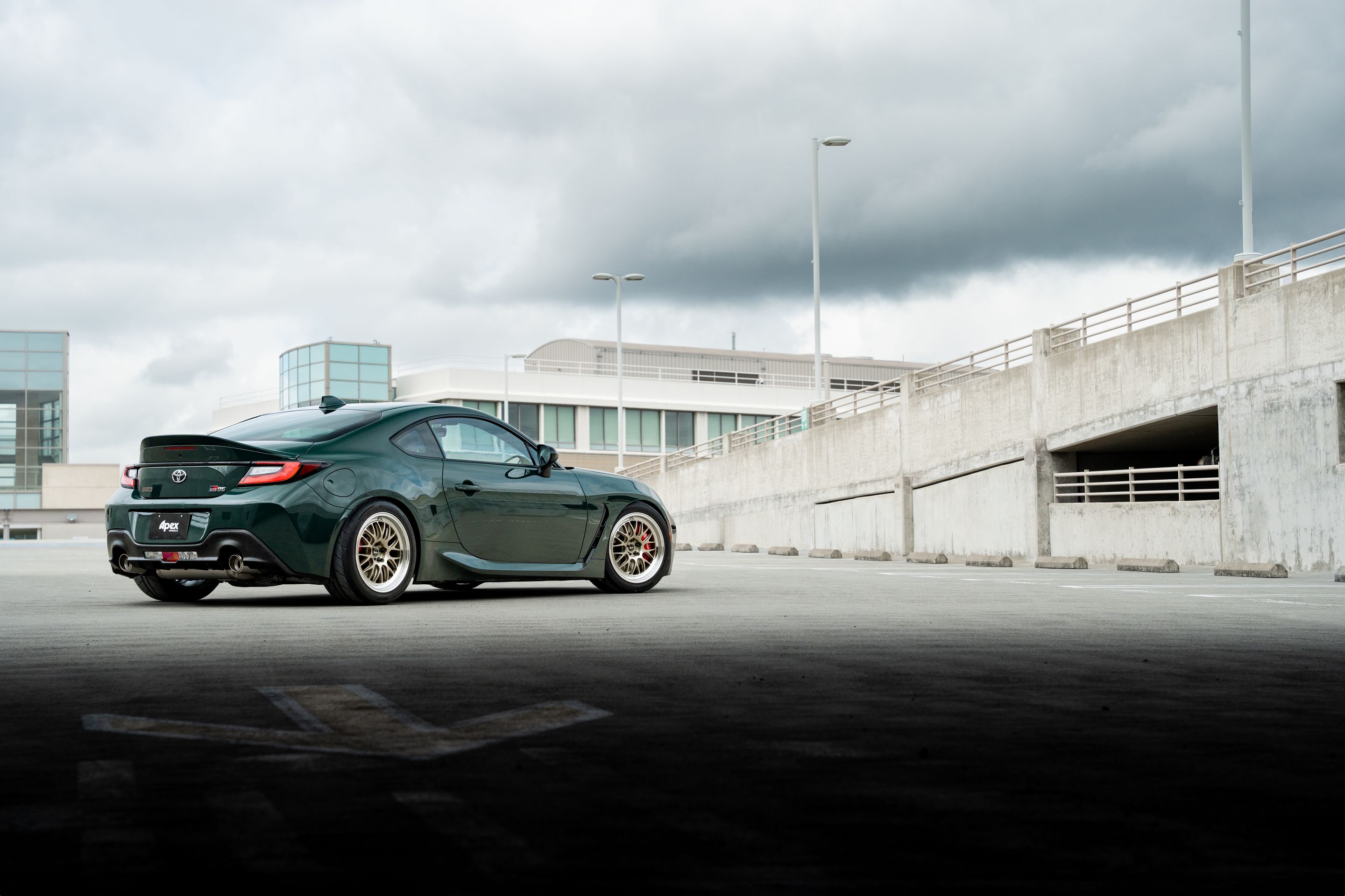Green Toyota GR86 with 17" ML-10RT Apex wheels in Machined Lip Gloss Motorsport Gold