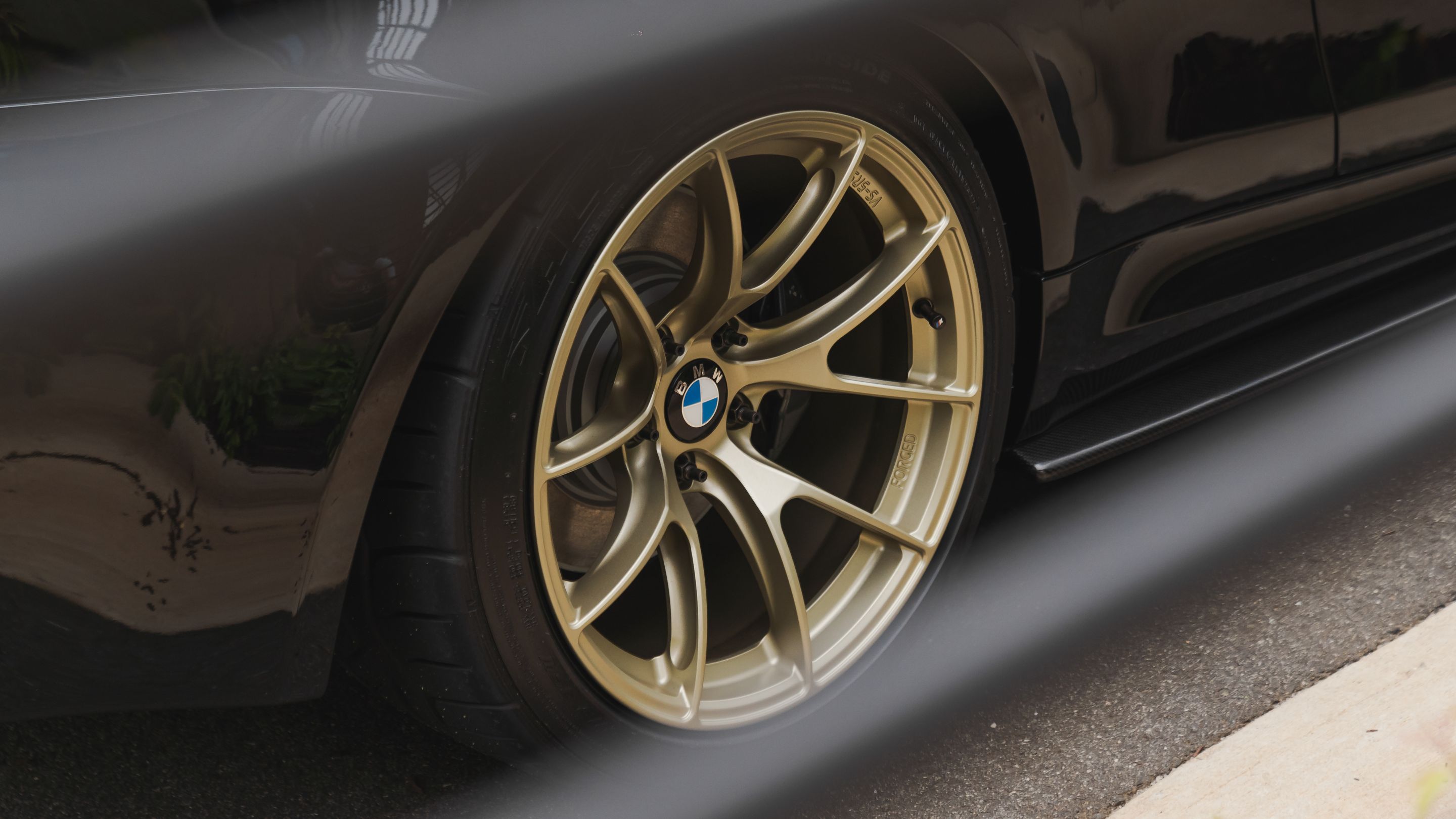 Black BMW E82 Coupe 1 Series with 18" VS-5RS Apex wheels in Motorsport Gold
