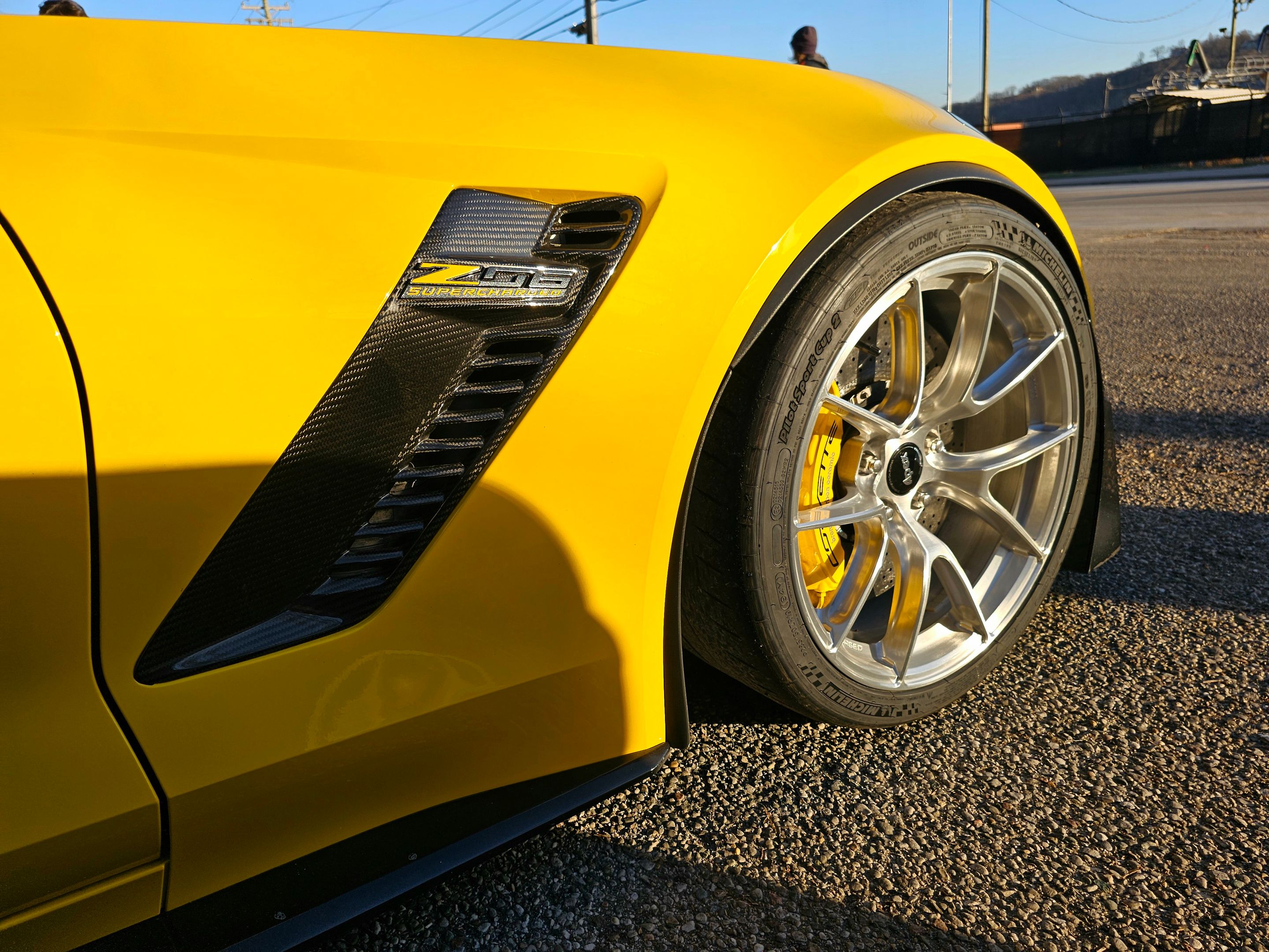 Yellow Chevrolet C7 Corvette Z06 with 19"/20" VS-5RS Apex wheels in Brushed Clear