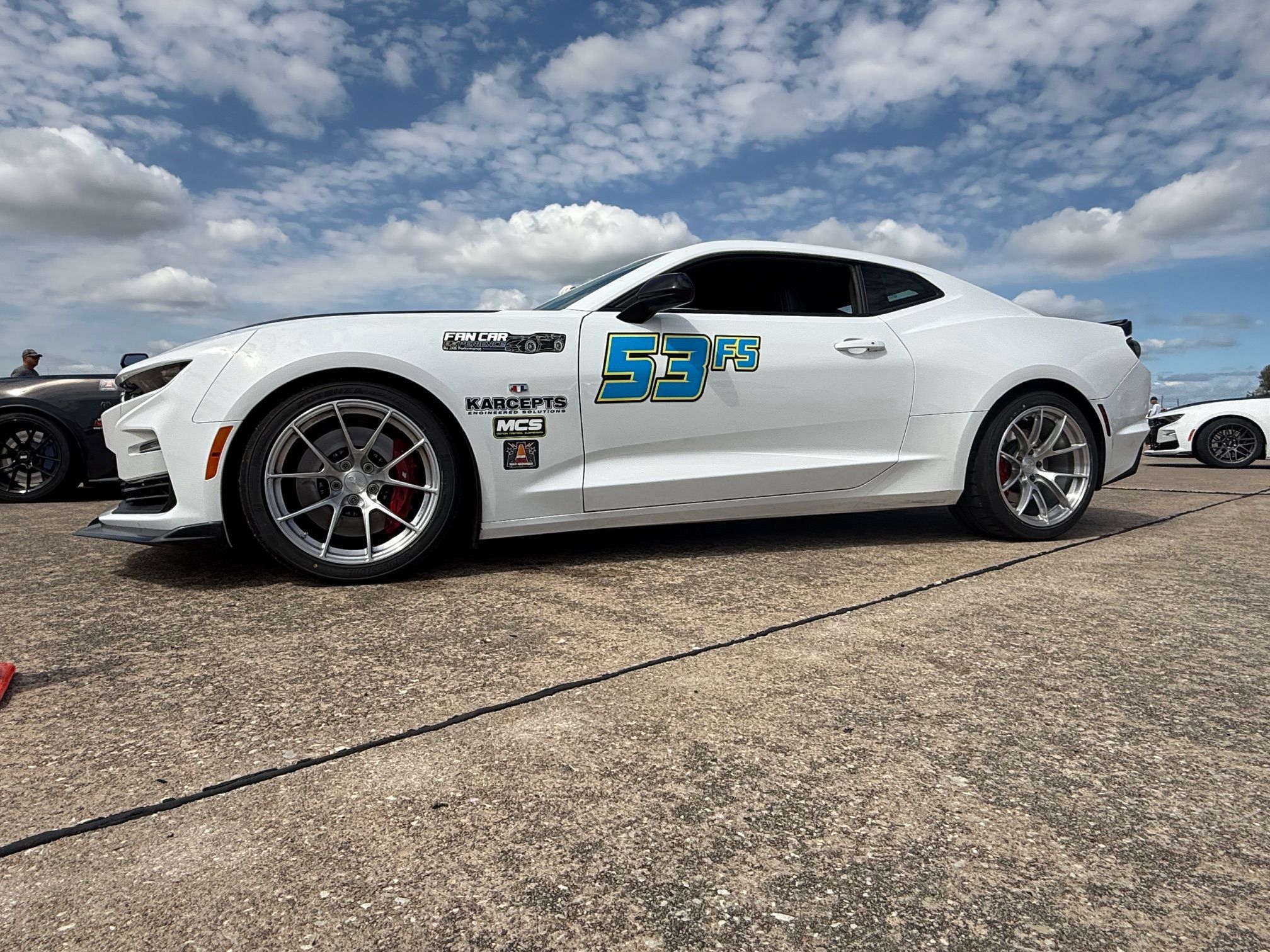 White Chevrolet 6th Gen Camaro SS with 19" VS-5RS Apex wheels in Brushed Clear