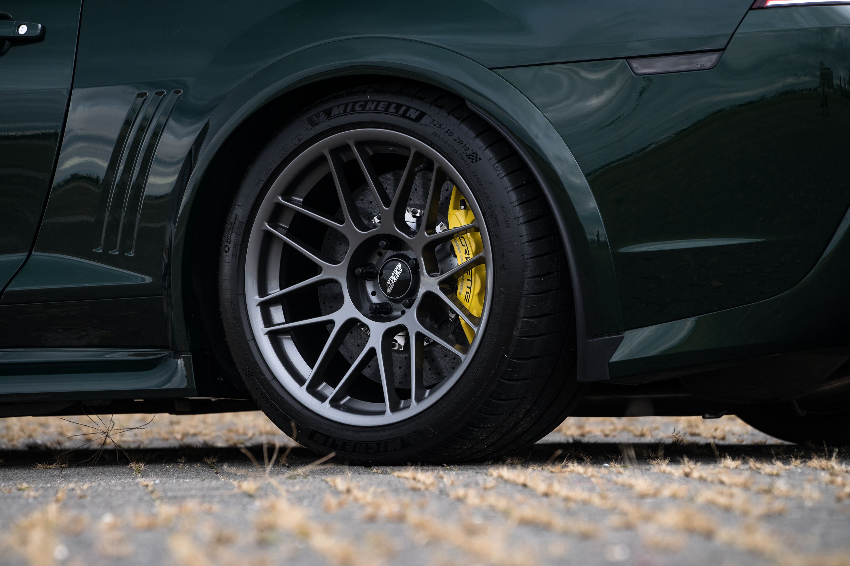 Green Chevrolet 5th Gen Camaro SS with 19" ARC-8 Apex wheels in Anthracite
