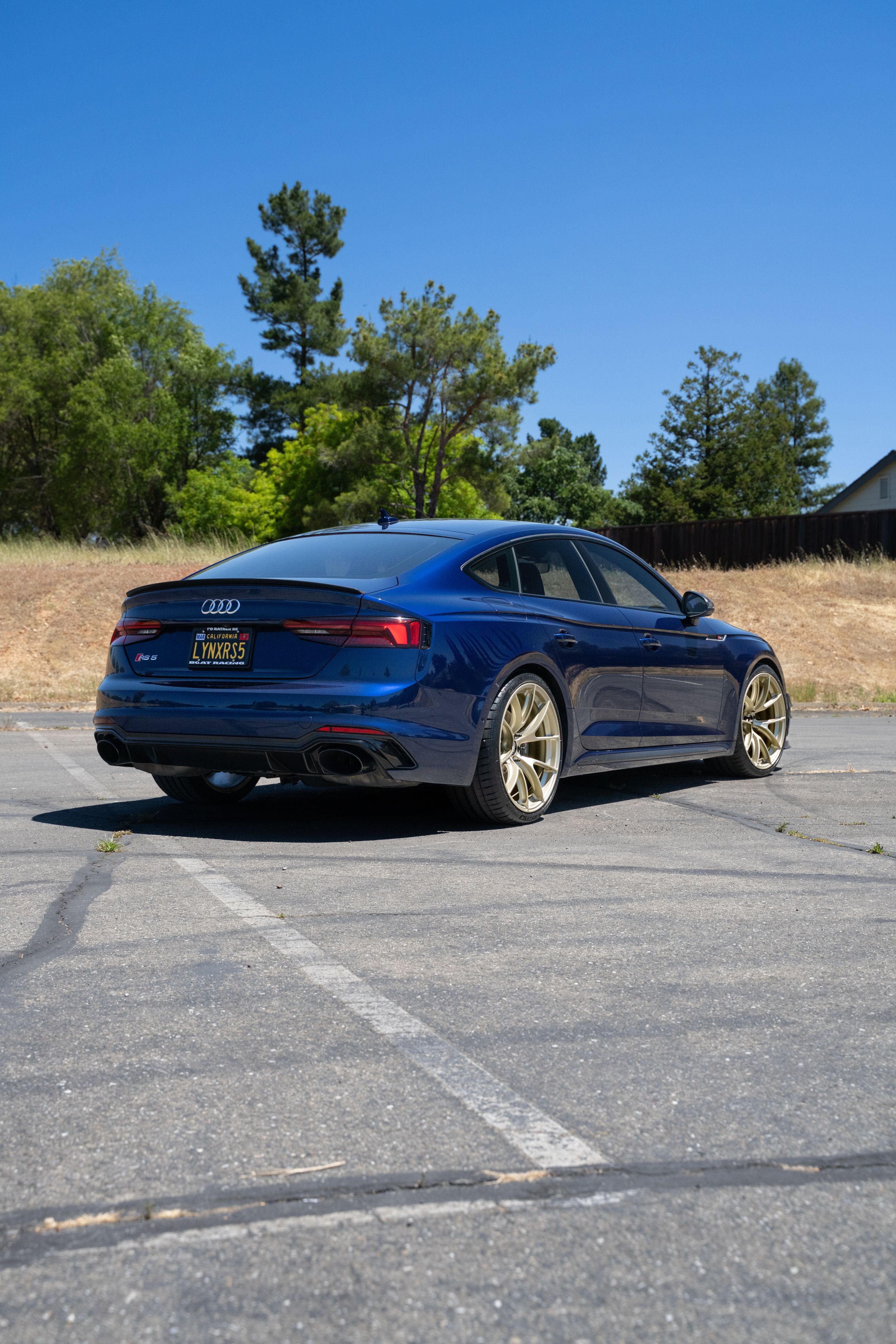 Blue Audi B9 RS 5 Sportback with 20" VS-5RS Apex wheels in Motorsport Gold