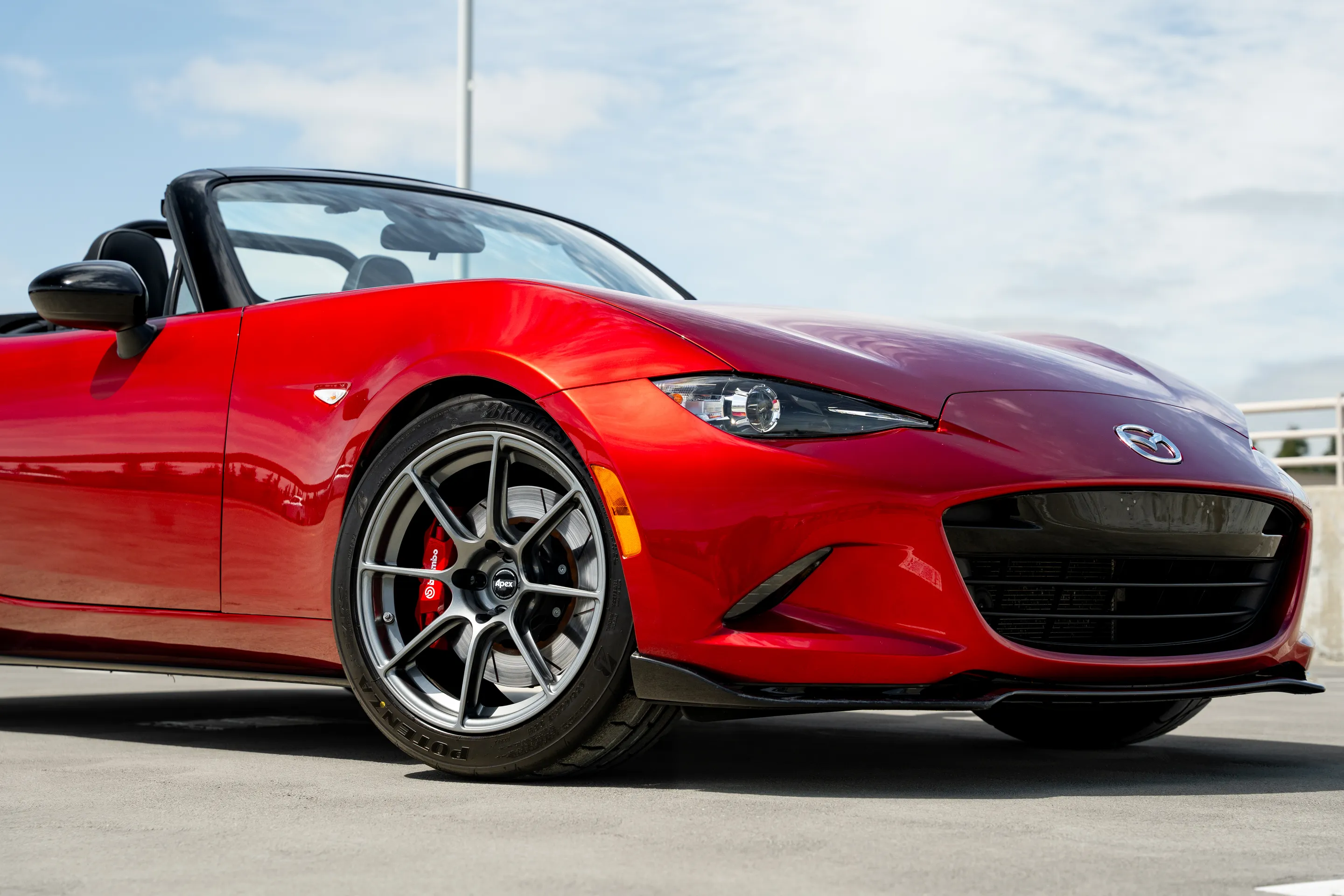 Red Mazda ND MX-5 Miata with 17" SM-8RS Apex wheels in Anthracite