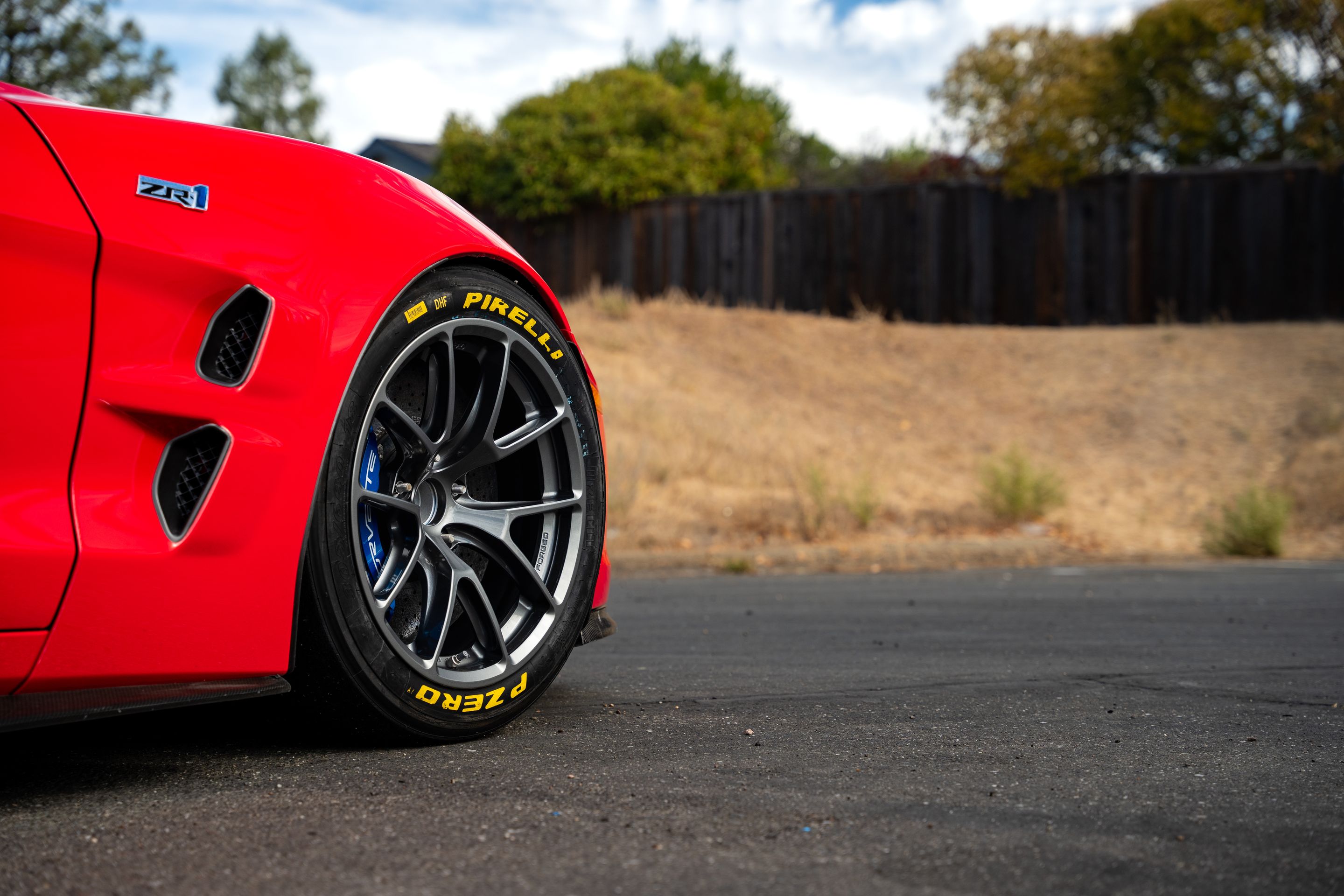 Red Chevrolet C6 Corvette ZR-1 with 18" VS-5RE Apex wheels in Anthracite