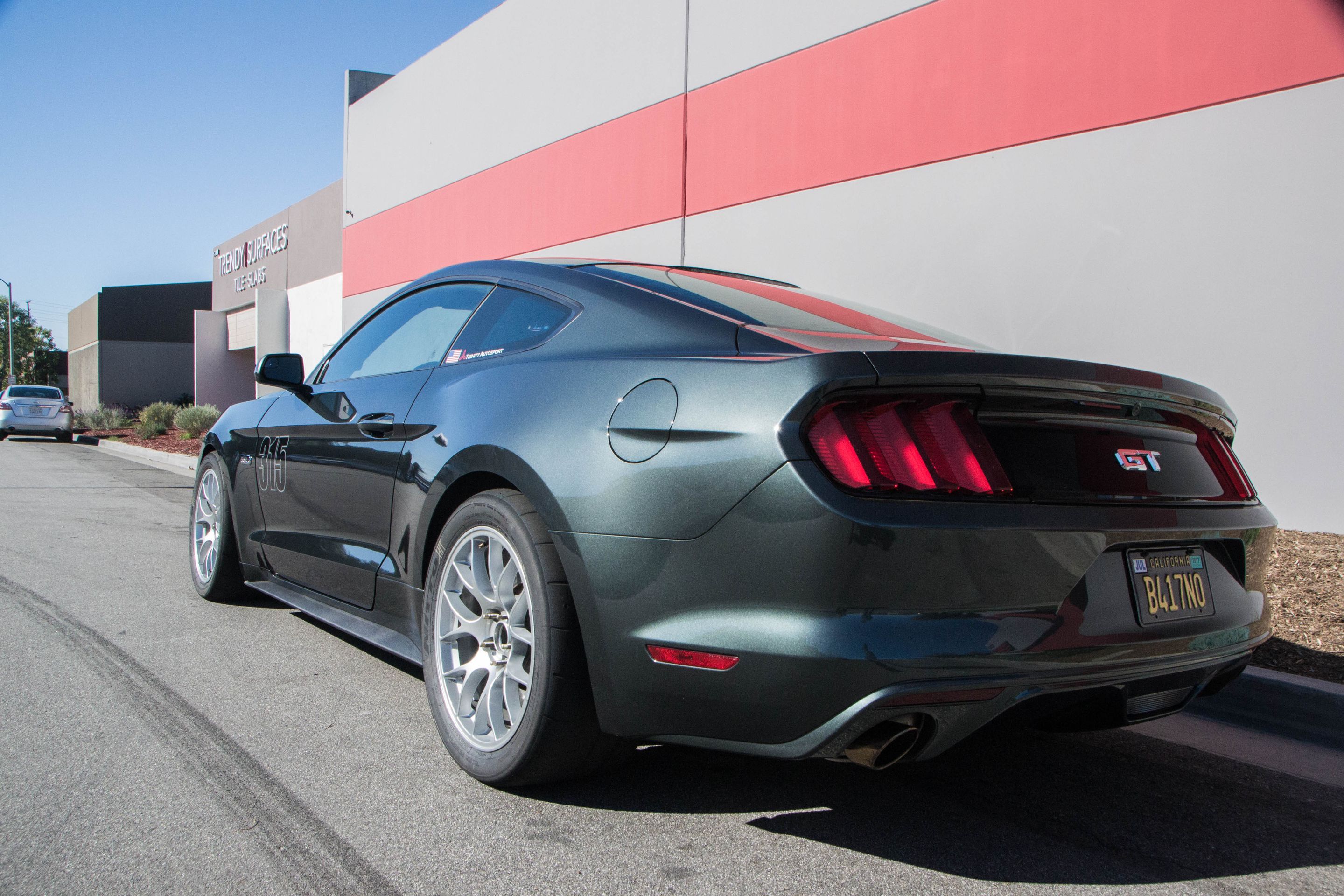 Green Ford S550 Mustang GT with 18" EC-7 Apex wheels in Race Silver